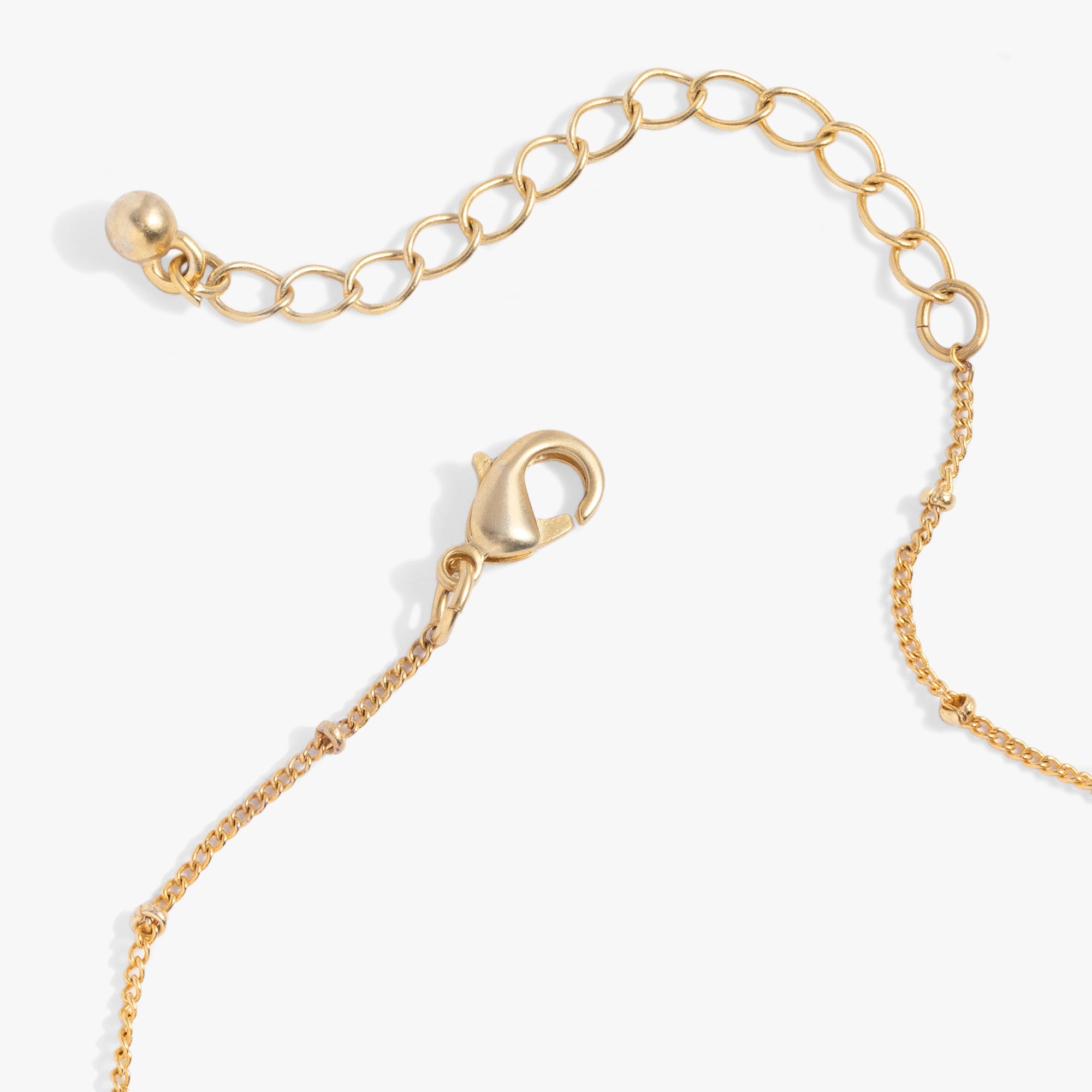 Antique gold Moon and Sun multicharm necklace by ALEX AND ANI featuring celestial charms on a delicate chain.