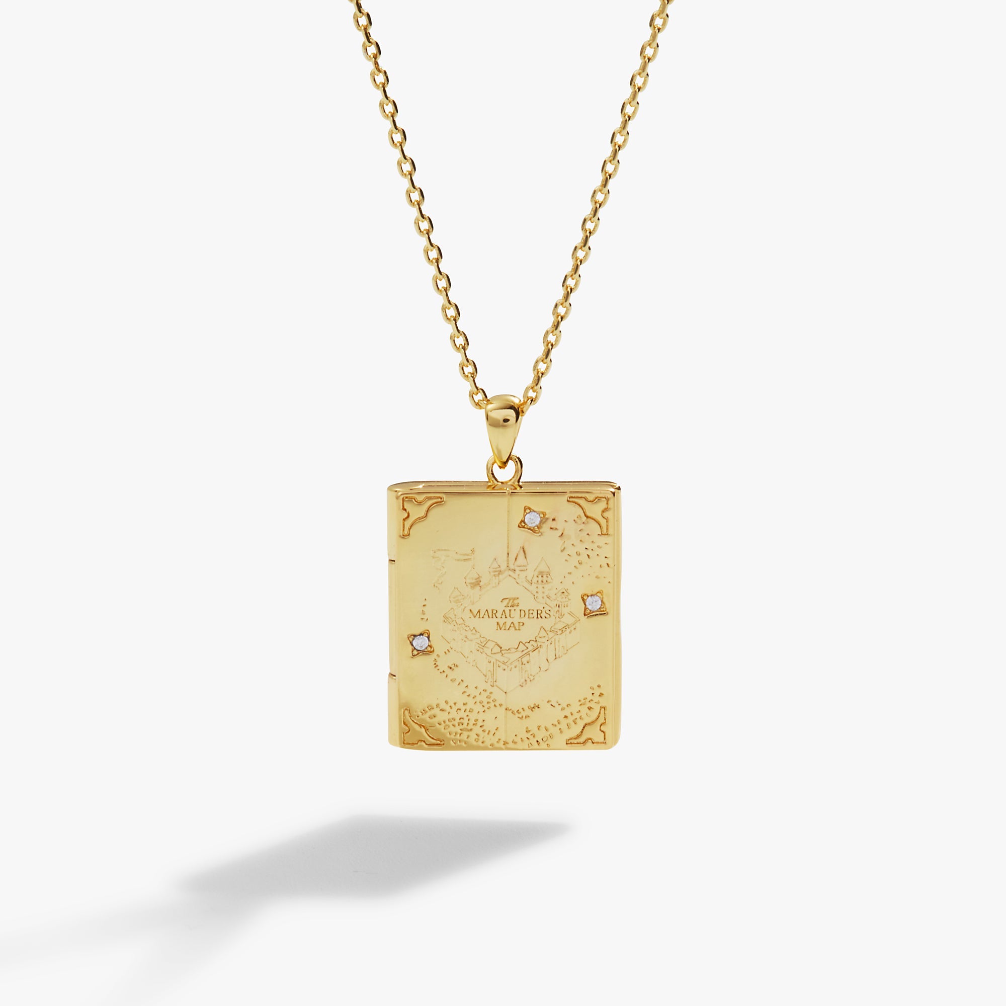 Gold Harry Potter Mischief Managed locket necklace by ALEX AND ANI, featuring a magical design with intricate detailing.