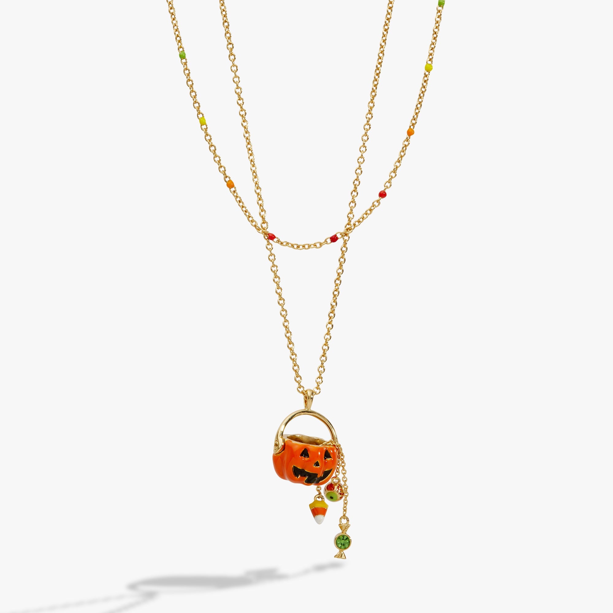 Gold 'Trick or Treat' layered necklace by ALEX AND ANI featuring Halloween-themed charms on a delicate chain.