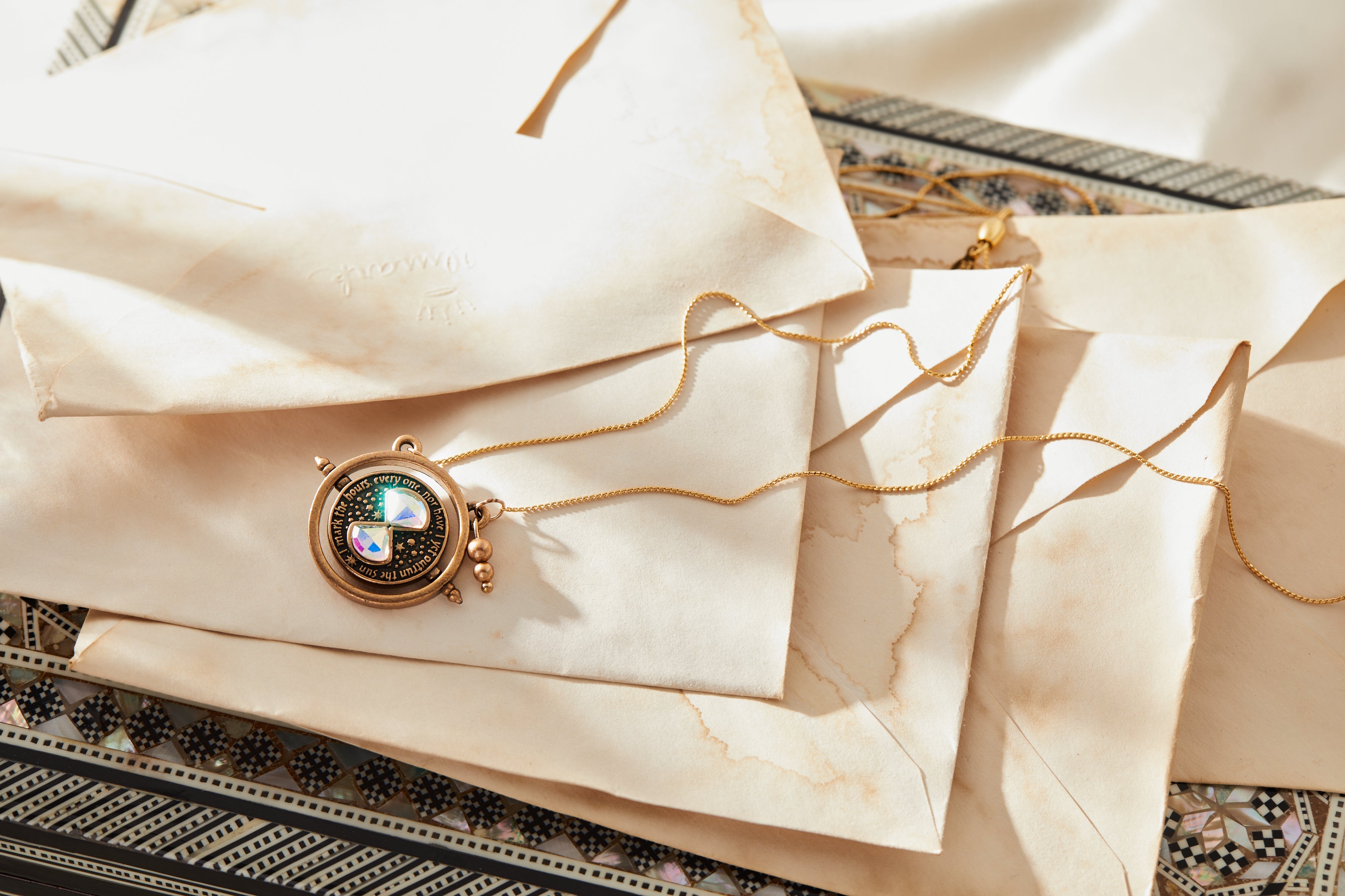 Gold Harry Potter™ Time Turner Spinner Necklace by ALEX AND ANI featuring a detailed pendant with rotating time turner design.
