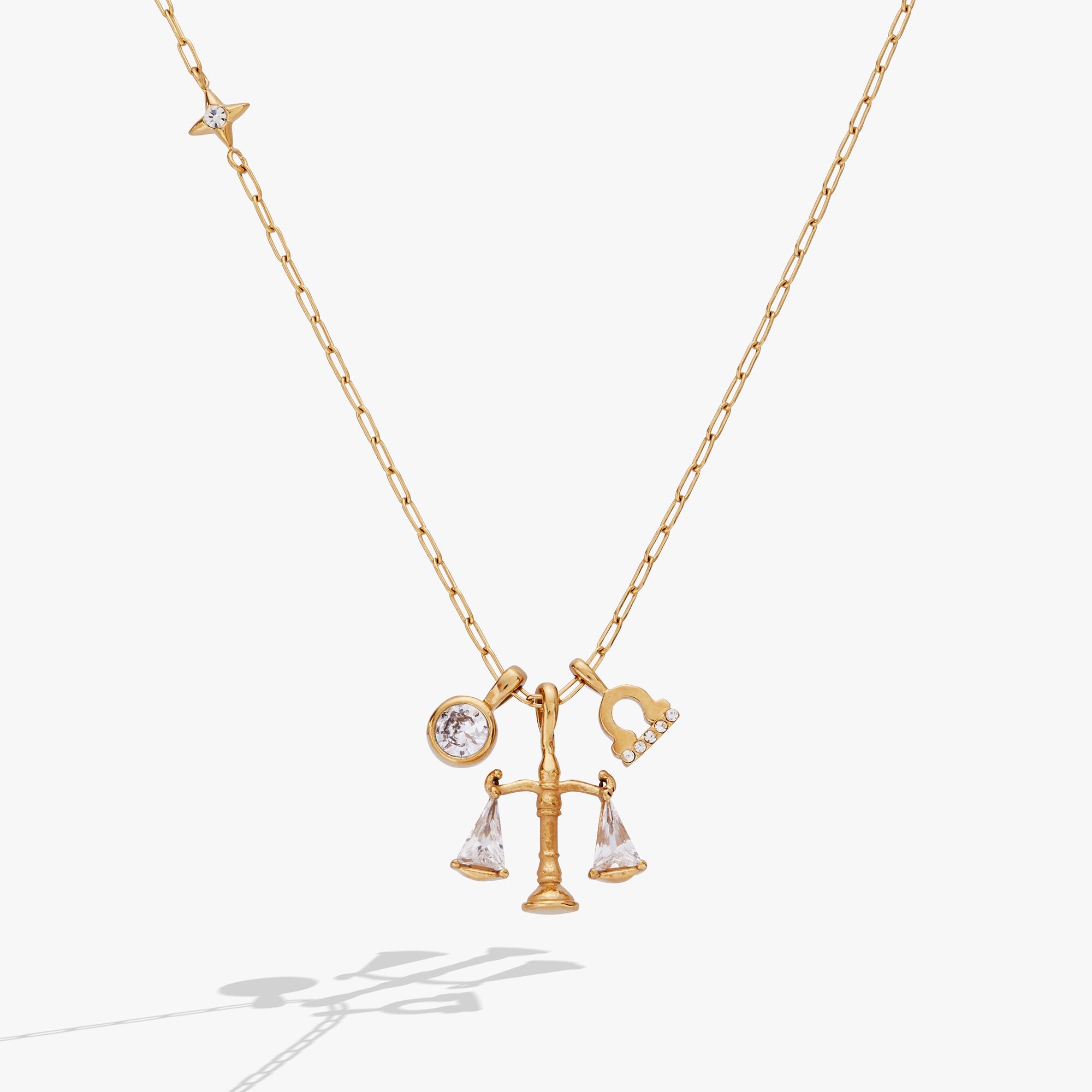 Gold Libra Zodiac Charm Cluster Necklace by ALEX AND ANI featuring stainless steel chain and zodiac-themed charms.