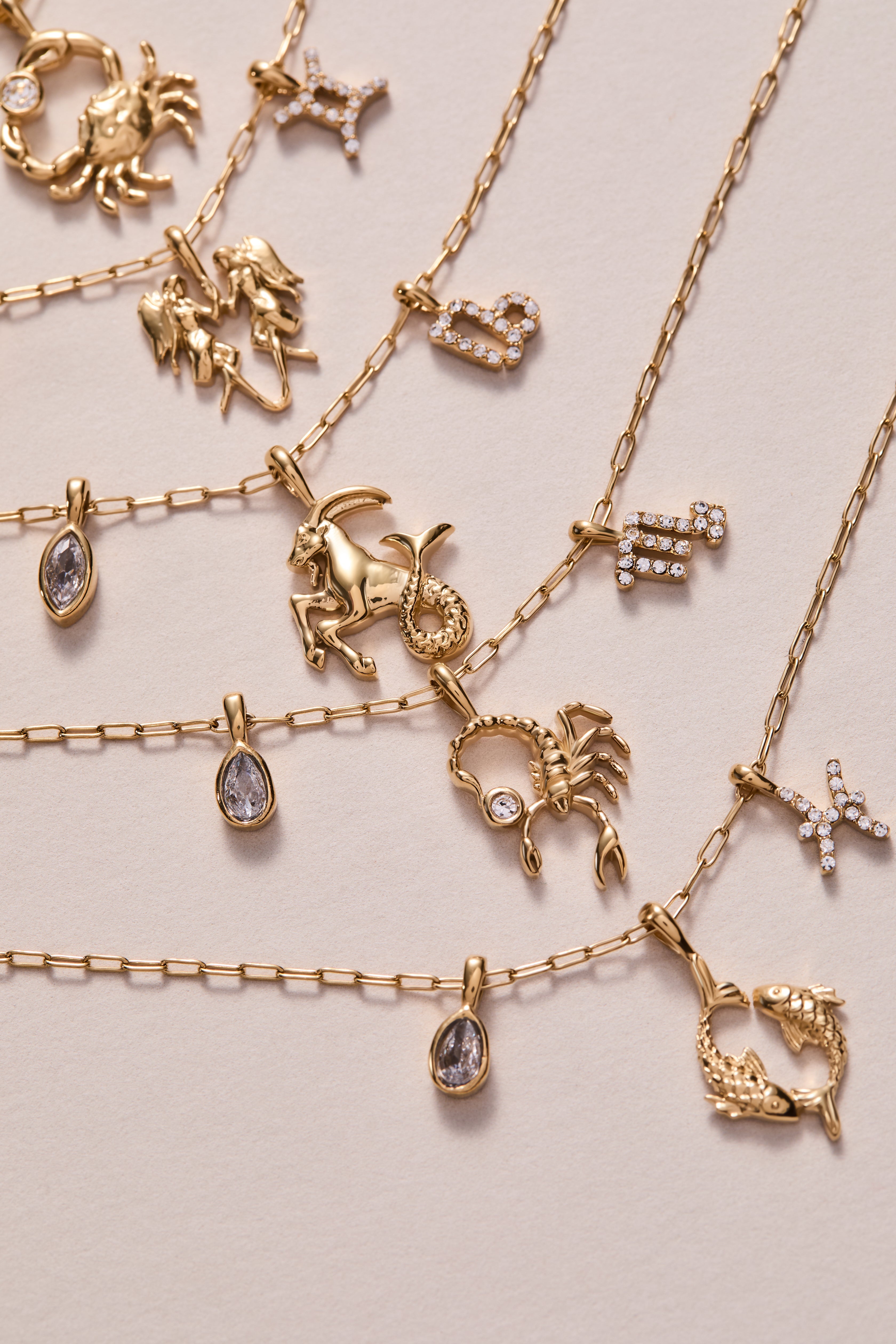 Gold stainless steel Scorpio Zodiac Charm Cluster Necklace by ALEX AND ANI featuring a detailed Scorpio pendant and chain.