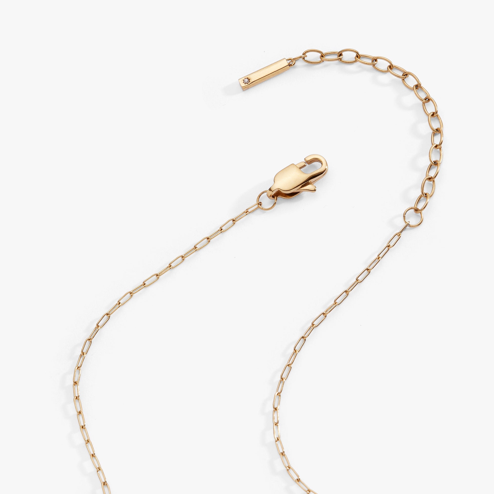 Gold Taurus zodiac charm cluster necklace by ALEX AND ANI featuring stainless steel chain and celestial-inspired design.
