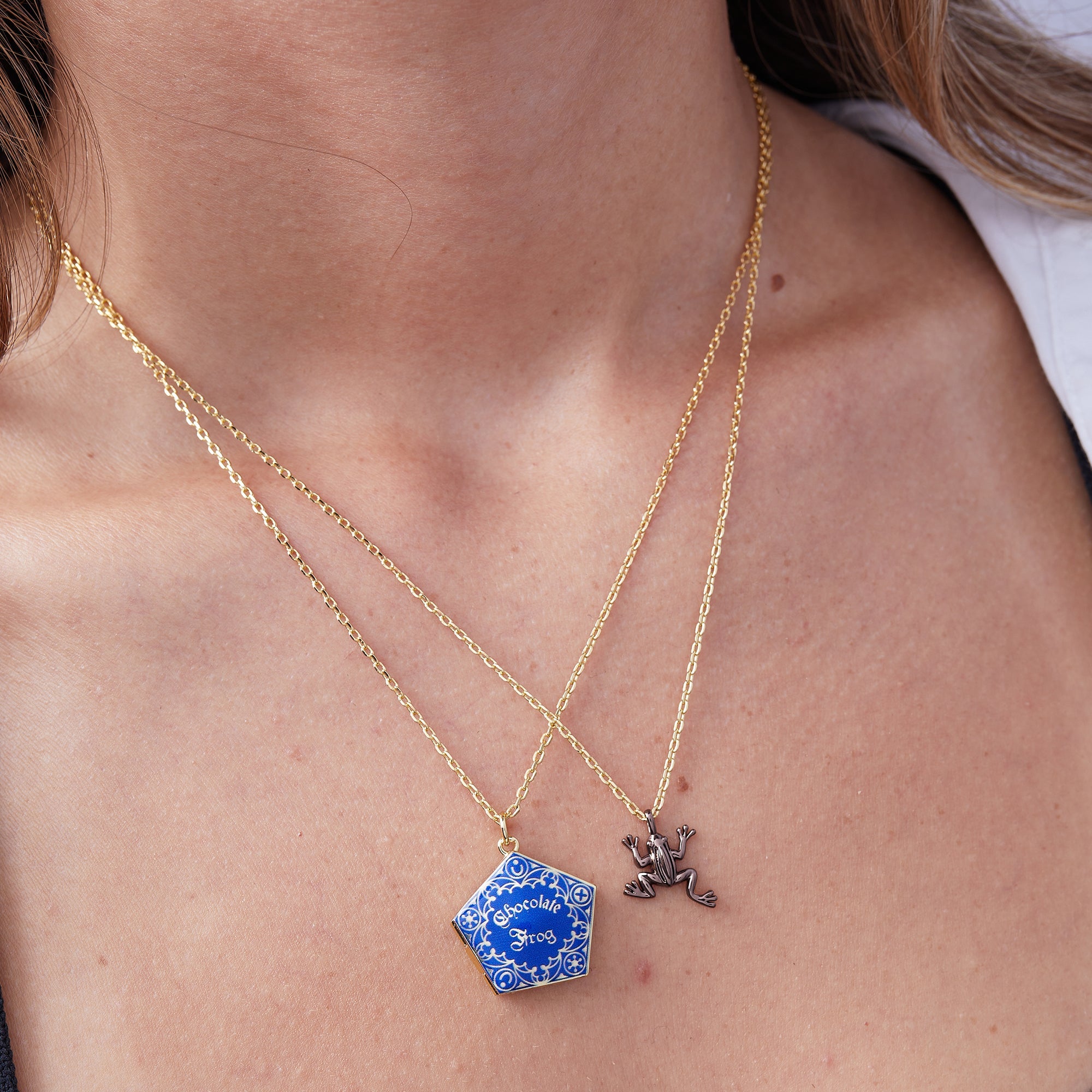 Set of two Harry Potter™ Chocolate Frog necklaces by ALEX AND ANI, featuring two-tone wizarding charm pendants.