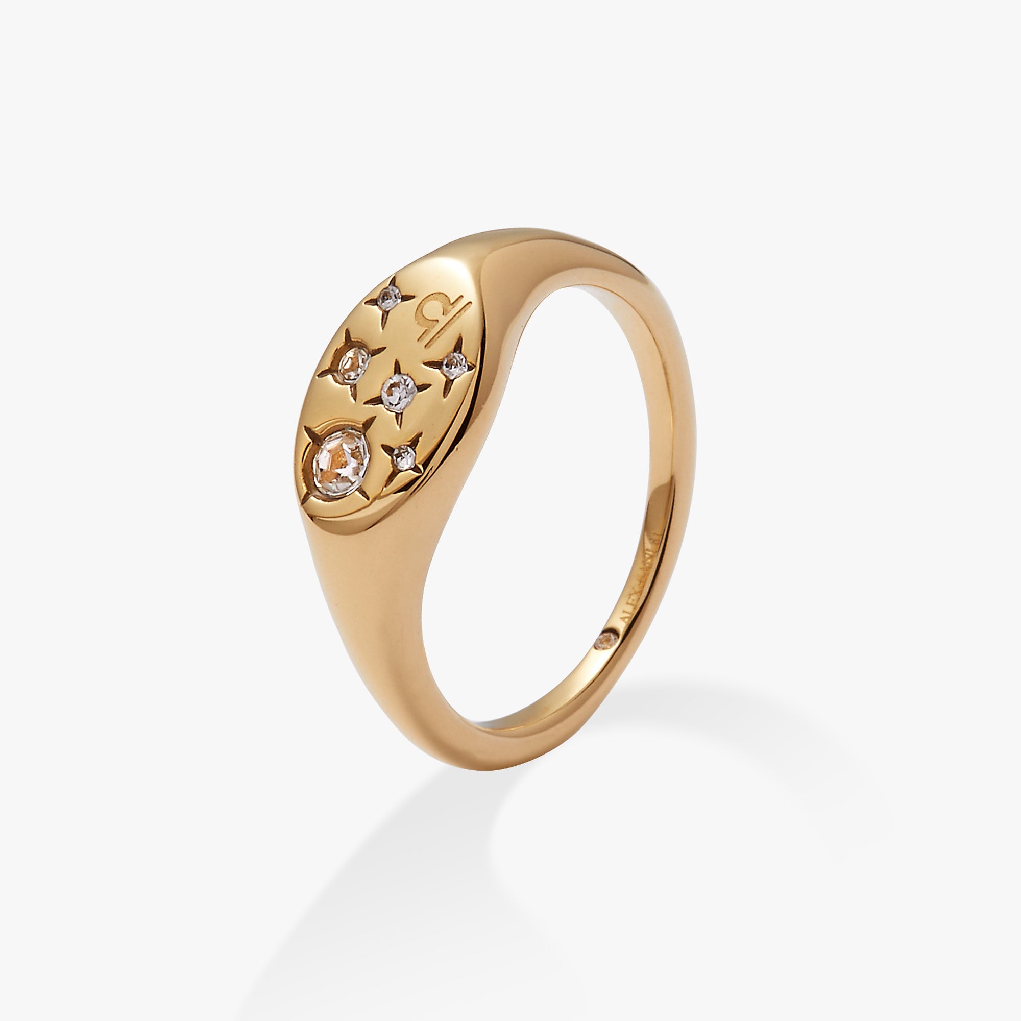 Gold stainless steel Libra zodiac ring by ALEX AND ANI featuring engraved Libra symbol and sleek design.