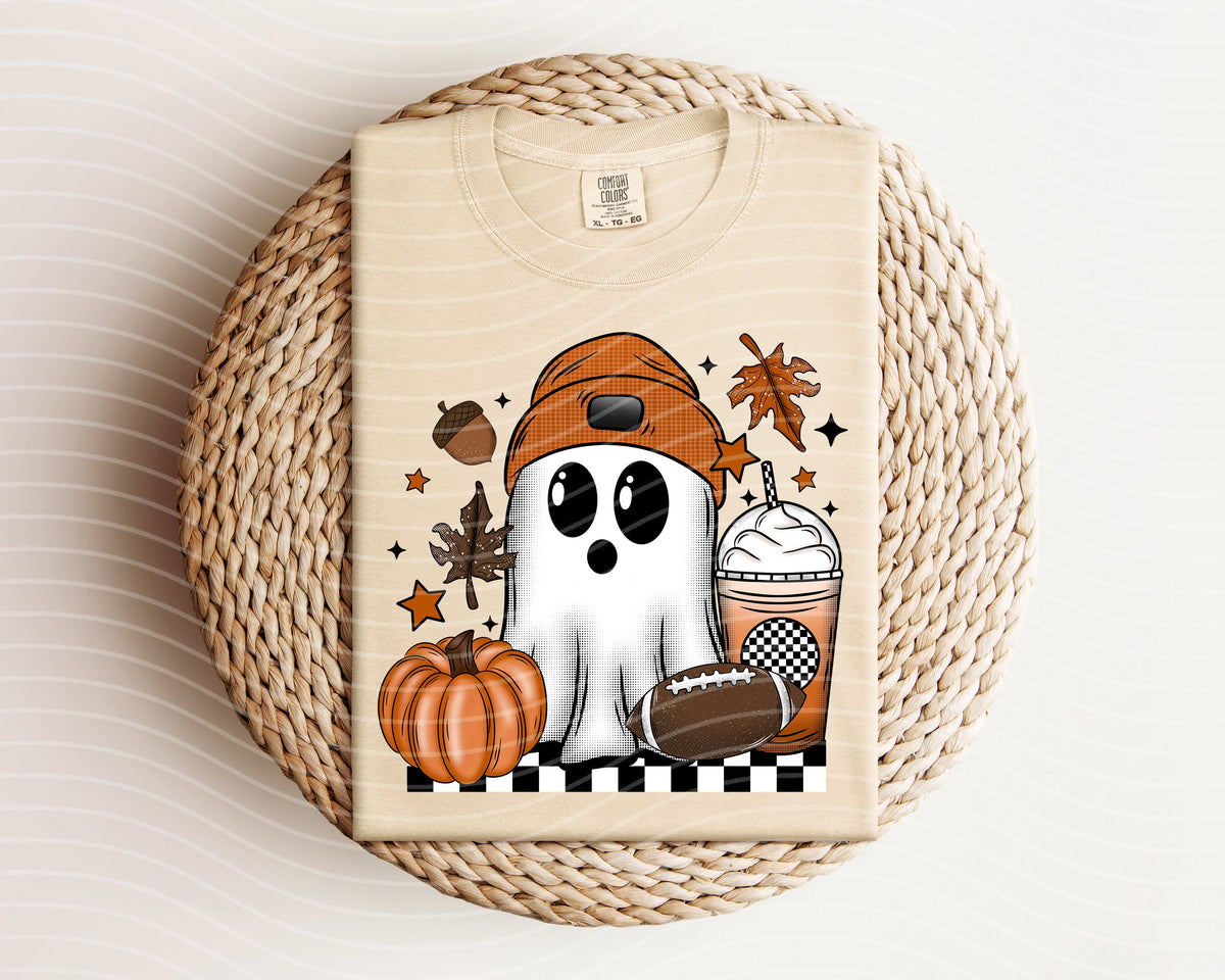 Black football ghost graphic tee from Anchored Grace Boutique, featuring a spooky football design on a casual women's graphic t-shirt.