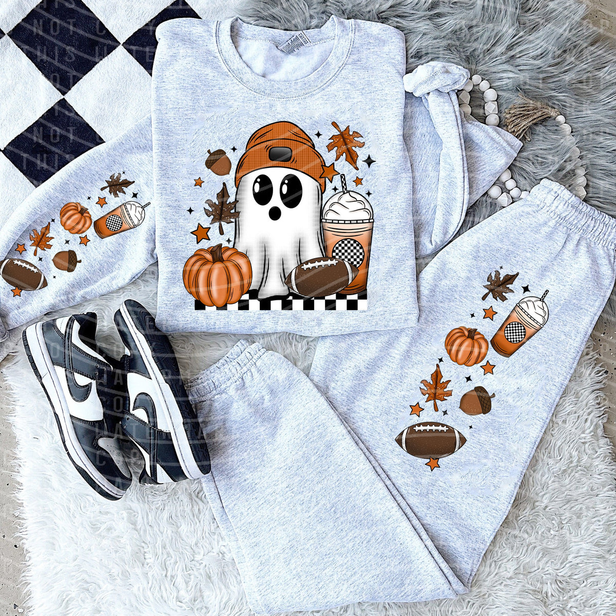 Football Ghost graphic tee by Anchored Grace Boutique featuring a spooky ghost with football elements on soft fabric.