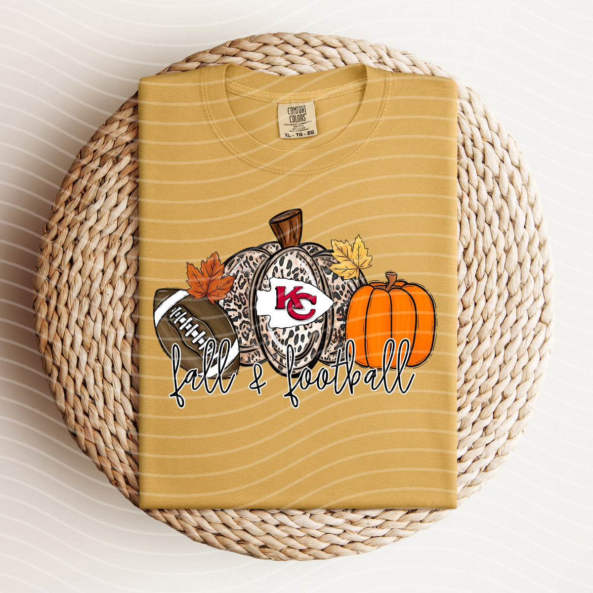 Football-themed graphic tee by Anchored Grace Boutique featuring fall colors and Chiefs logo design.
