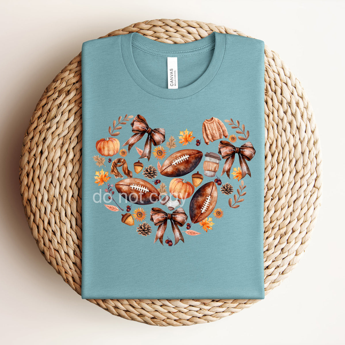 Fall Football Heart Graphic Tee from Anchored Grace Boutique featuring a football and heart design on a casual t-shirt.