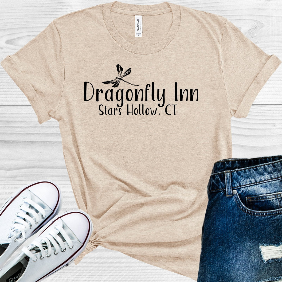 White graphic tee from Anchored Grace Boutique featuring the Gilmore Girls Dragonfly Inn and Stars Hollow, CT design.
