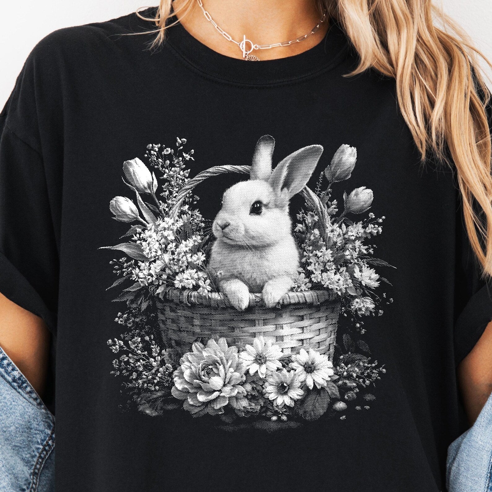 Black and white bunny graphic tee from Anchored Grace Boutique featuring a playful bunny illustration on soft cotton fabric.