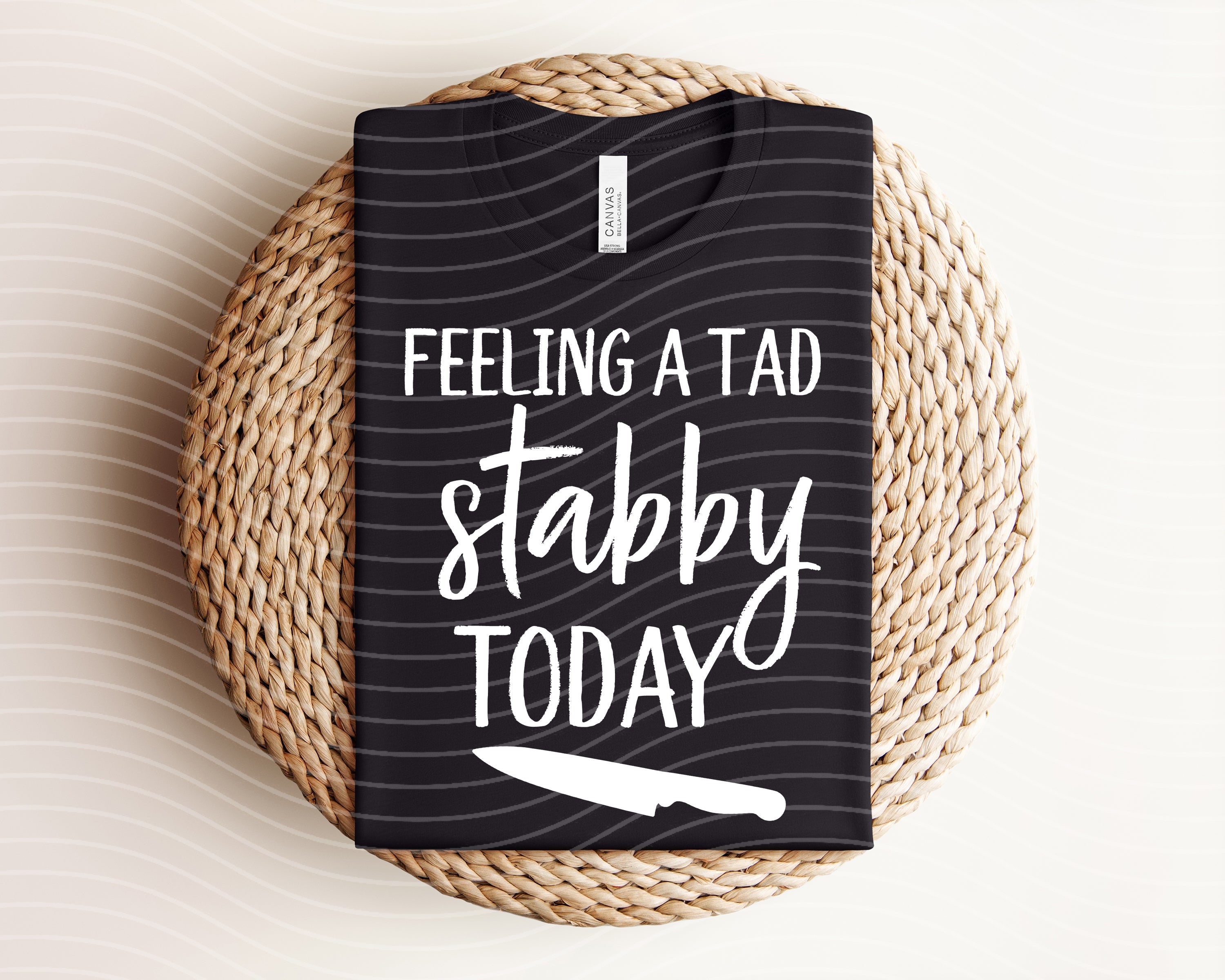Feeling a Tad Bit Stabby Today graphic tee by Anchored Grace Boutique, featuring bold text and casual fit on a white T-shirt.