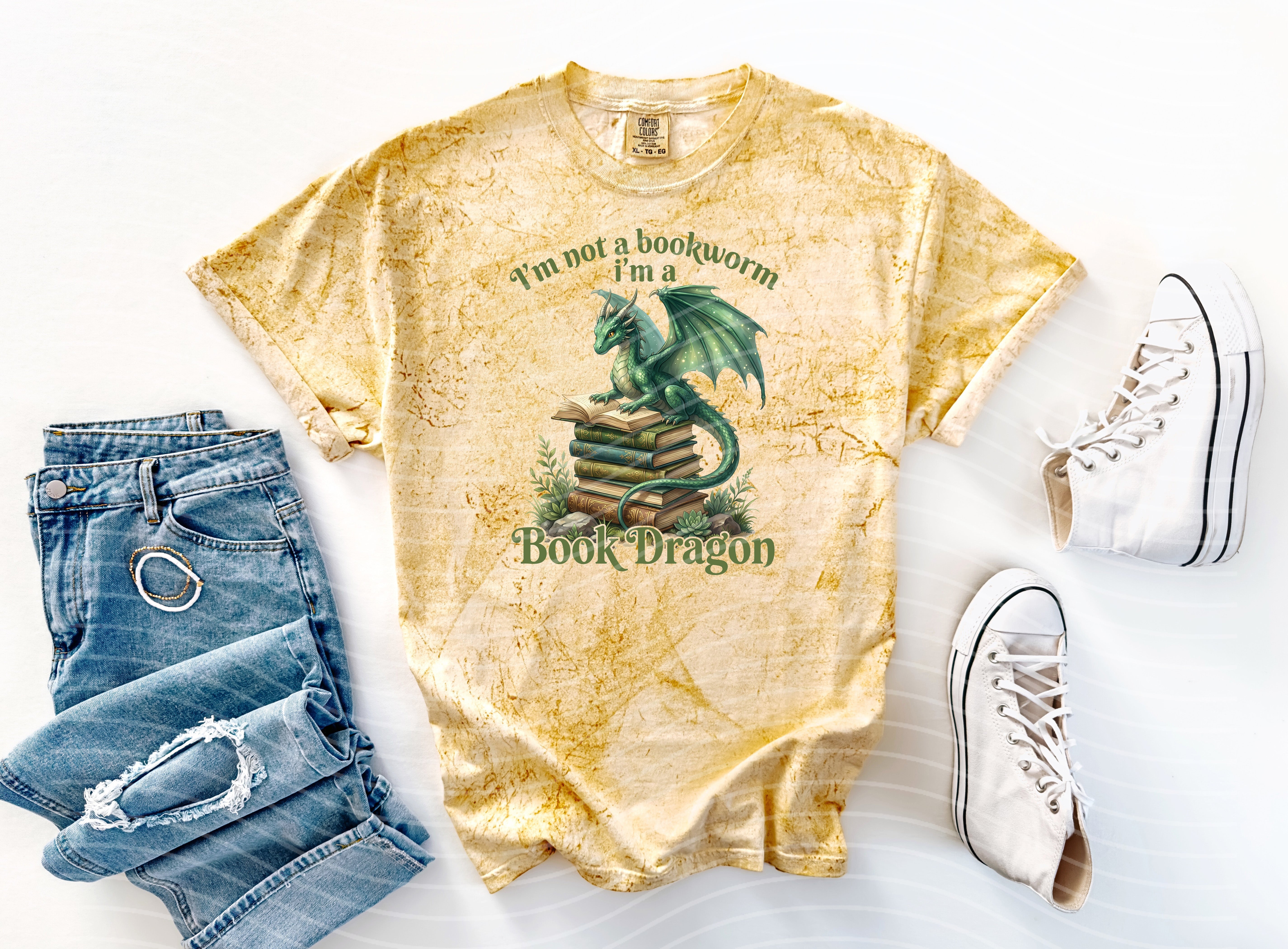 I'm a Book Dragon graphic tee by Anchored Grace Boutique featuring a colorful book and dragon illustration on a casual t-shirt.