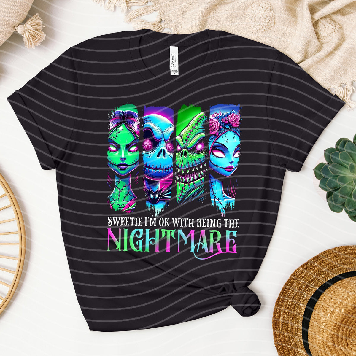 Black graphic tee by Anchored Grace Boutique featuring bold "I'm Ok with Being the Nightmare" text on the front.