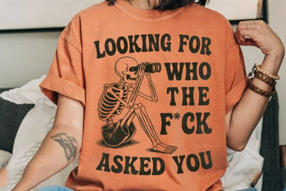 Black graphic tee by Anchored Grace Boutique featuring bold "Looking for Who the F*ck Asked You" text on the front.