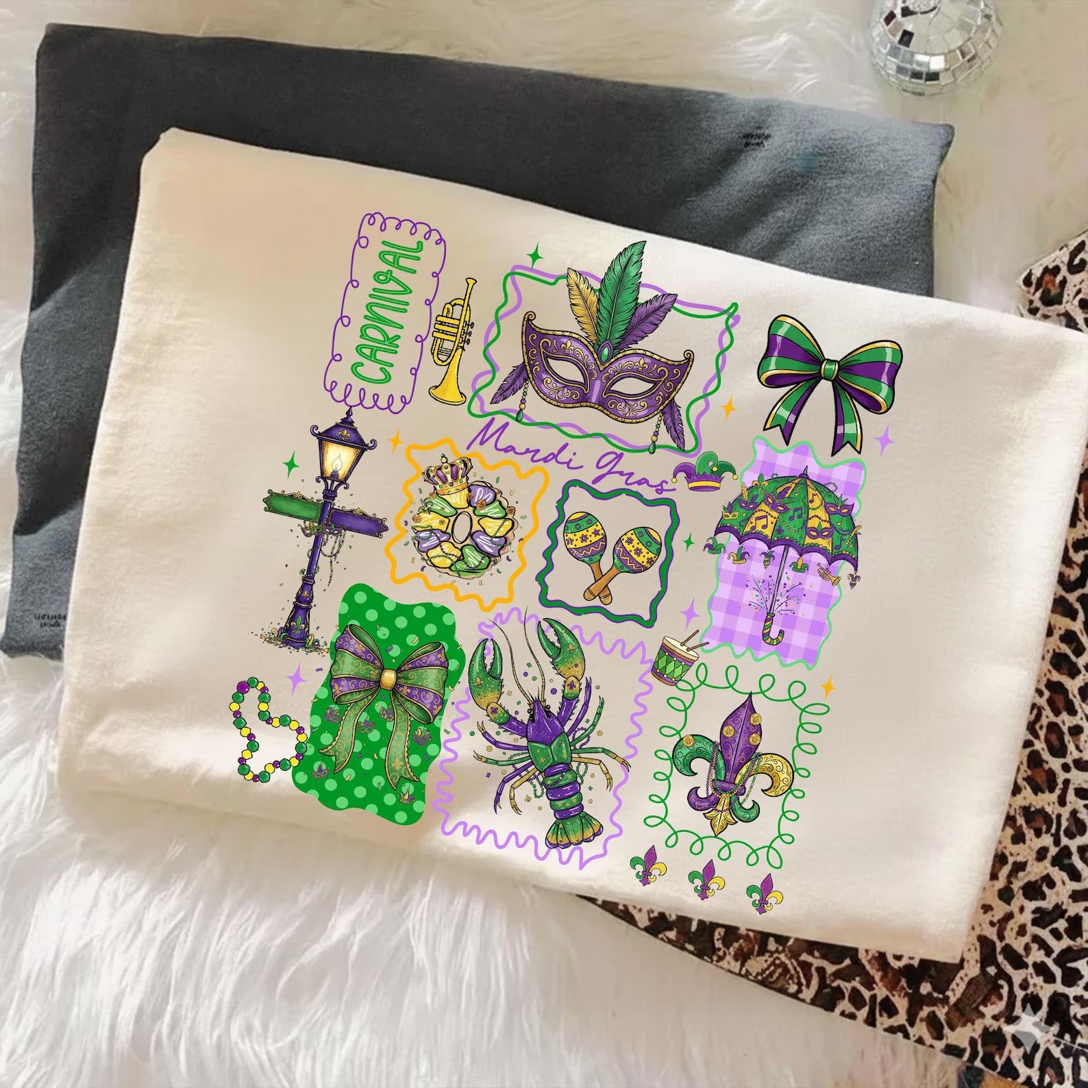 Mardi Gras Carnival graphic tee by Anchored Grace Boutique featuring colorful festive design on a casual cotton t-shirt