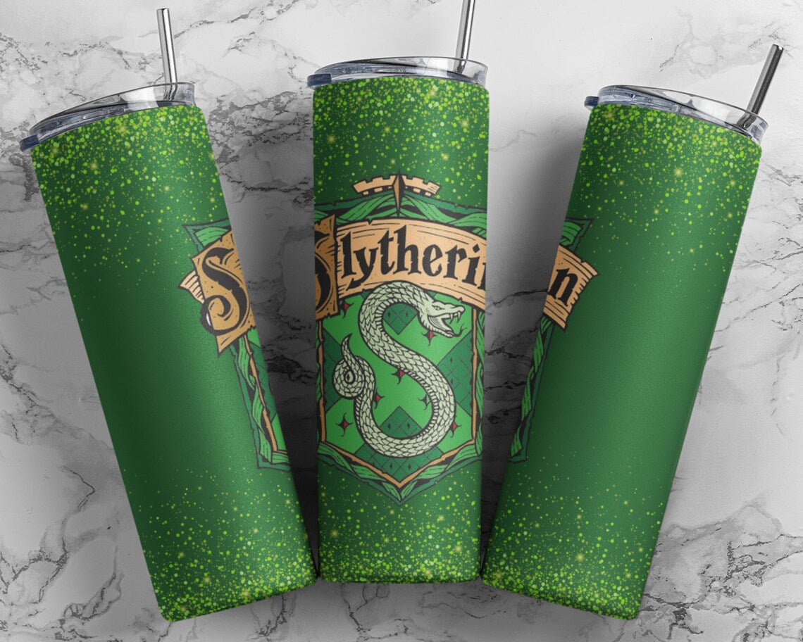 Slytherin 20 oz skinny tumbler from Anchored Grace Boutique with green and silver design and Slytherin logo.