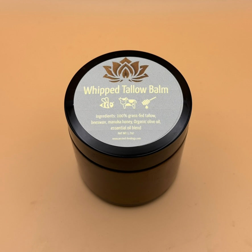 Creamy whipped tallow balm from Ancient Health & Healings, a natural skin care product in a 7oz jar with a smooth texture.