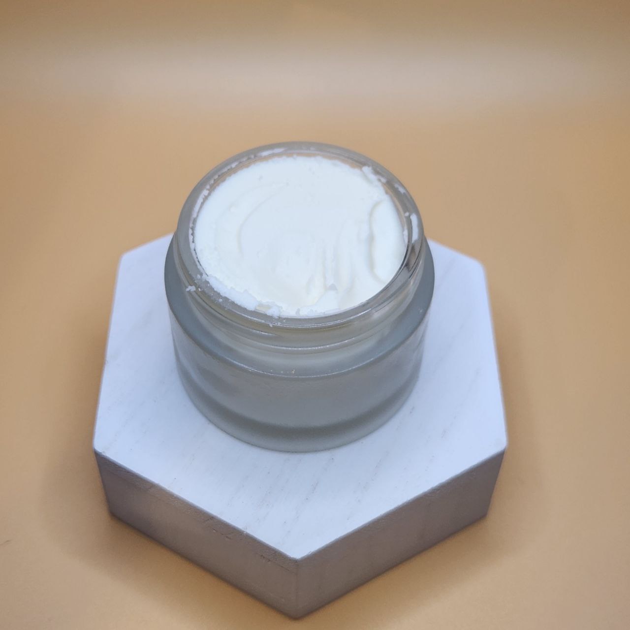 Whipped Tallow Balm by Ancient Health & Healings, a skin care product in a 7oz jar with smooth, creamy texture for moisturizing skin.