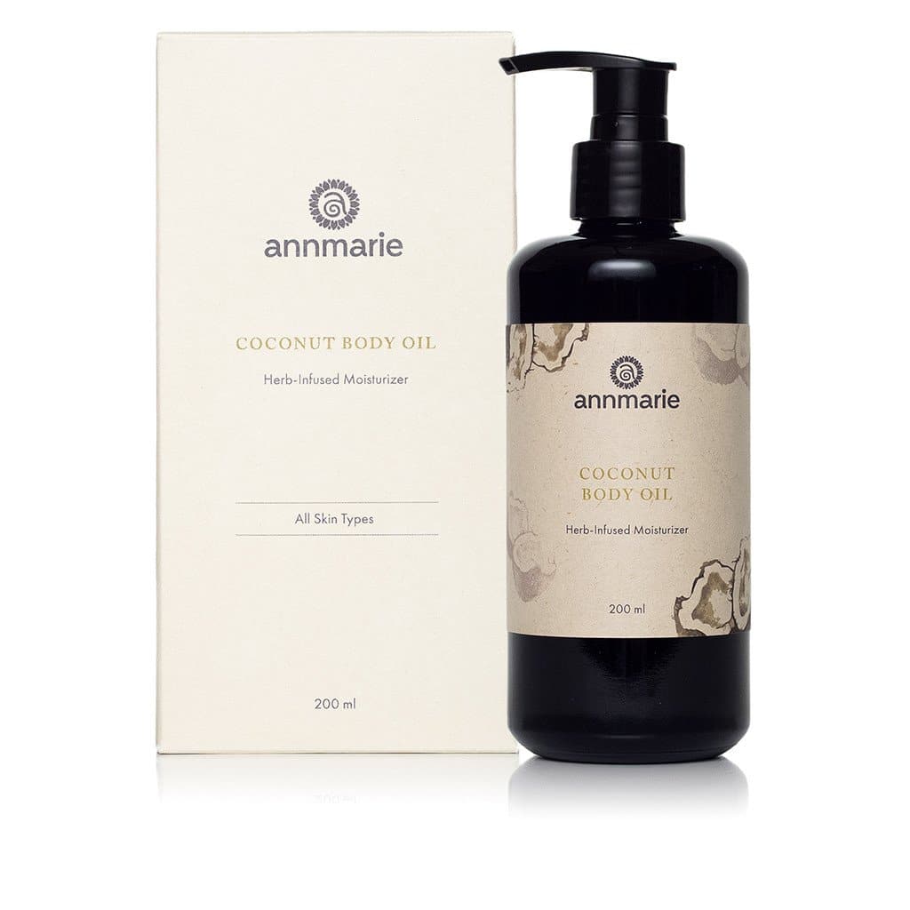 Bottle of Annmarie Skin Care Coconut Body Oil in 200ml size, featuring a clear container with coconut oil inside.