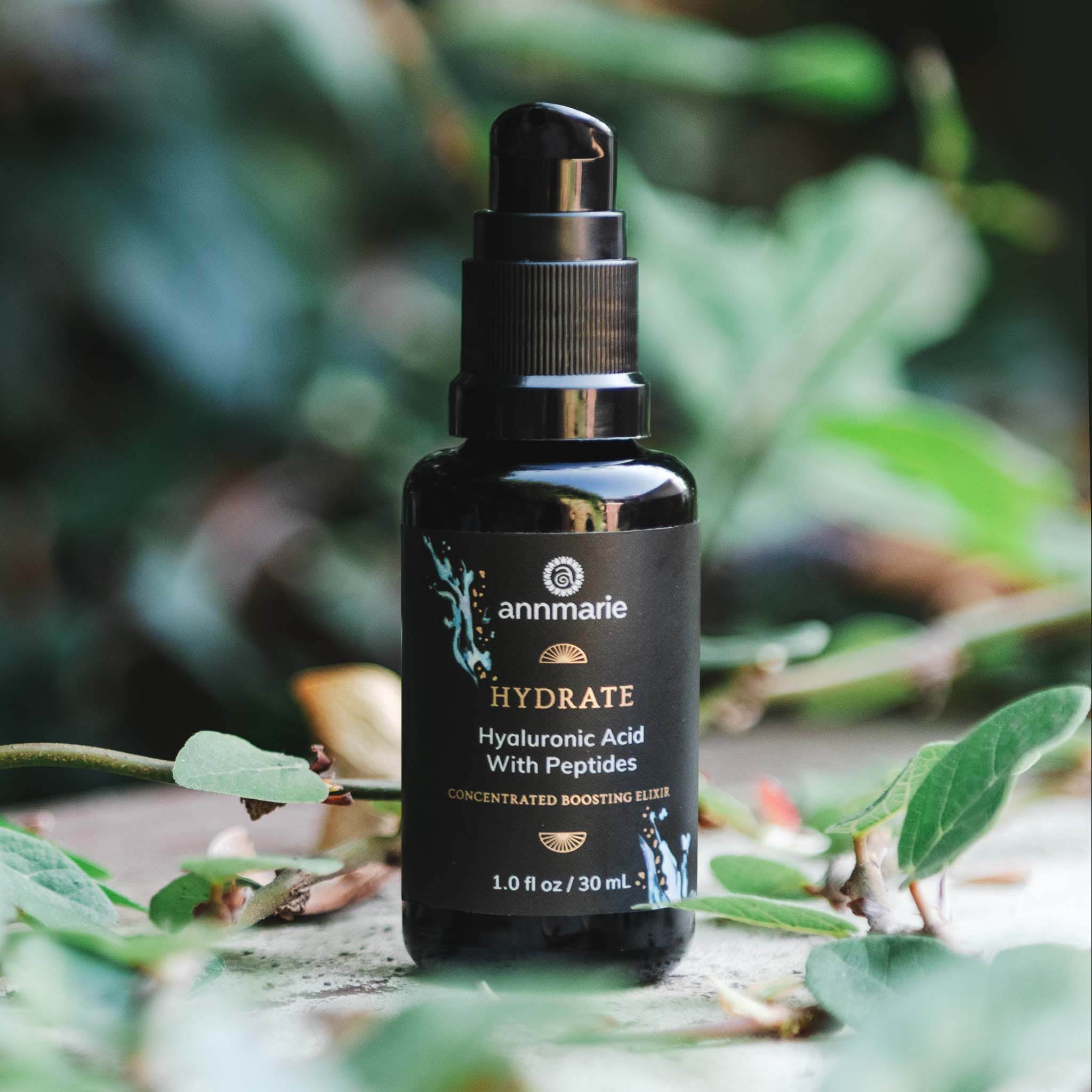 Bottle of Annmarie Skin Care Hydrate Hyaluronic Acid with Peptides serum in a 30ml container, featuring a clear pump dispenser.