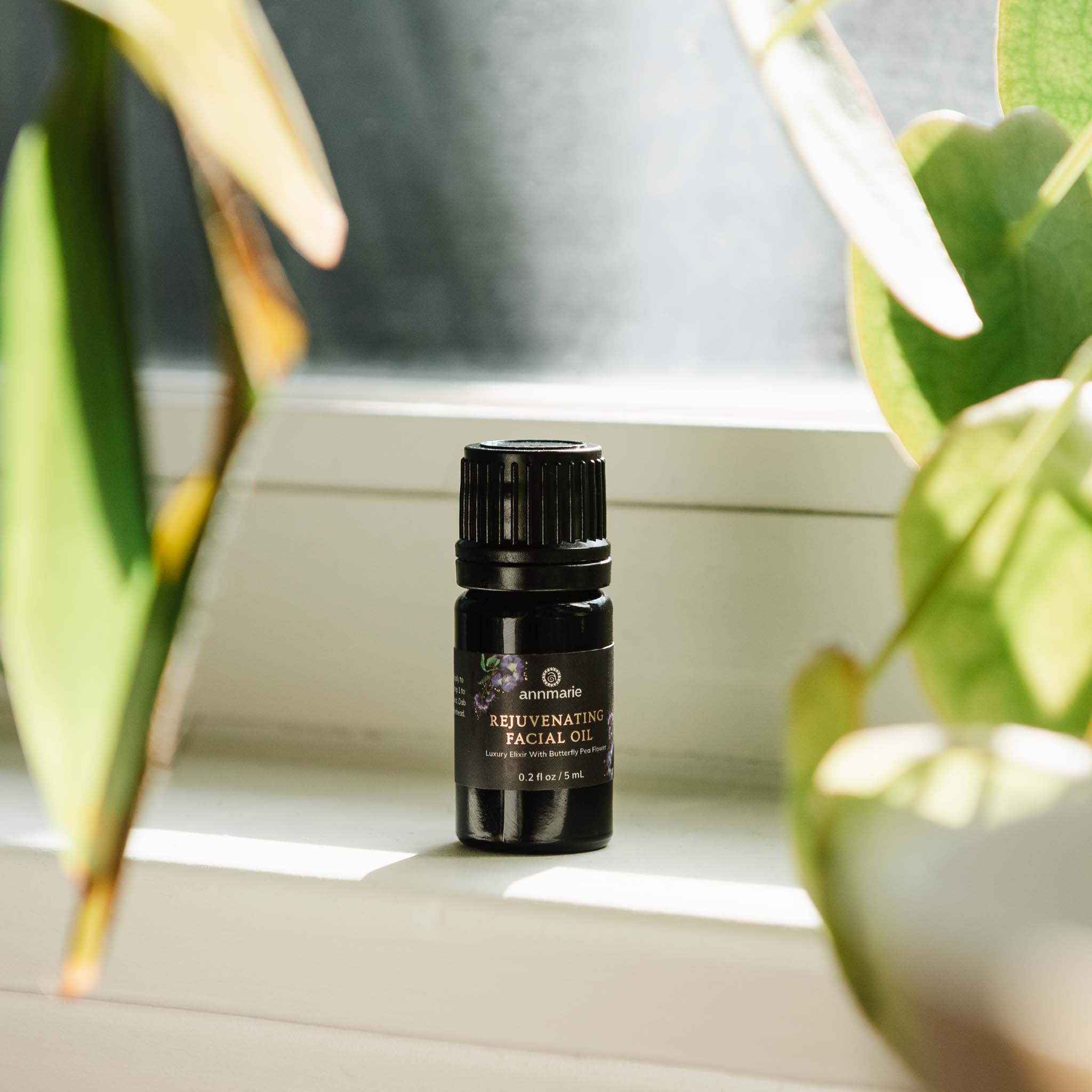 Small 5ml trial size of Annmarie Skin Care Rejuvenating Facial Oil, natural skincare for glowing, refreshed skin.