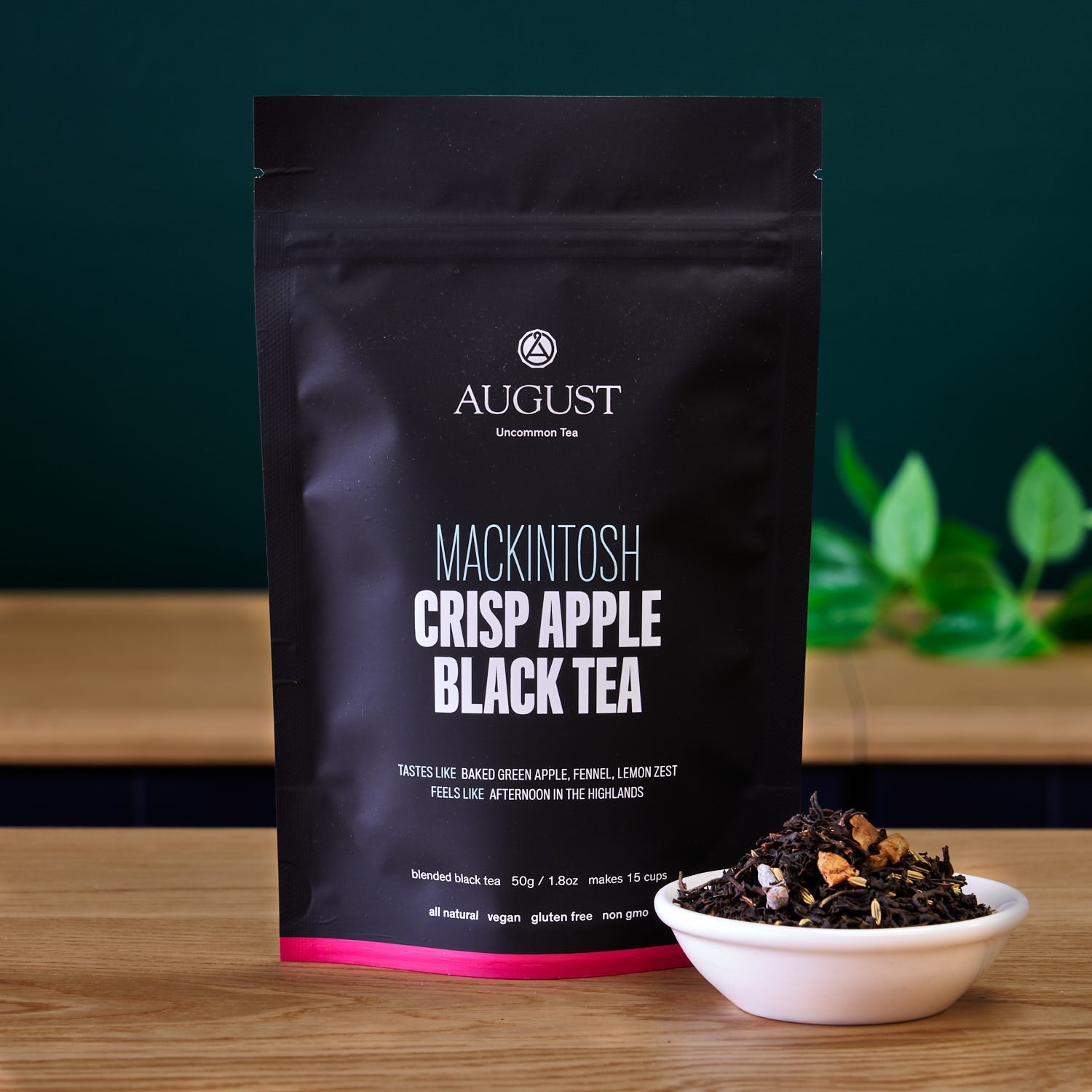 August Uncommon Tea Mackintosh Crisp Apple Black Tea in a 15-cup bag, showcasing black tea leaves with apple flavor.