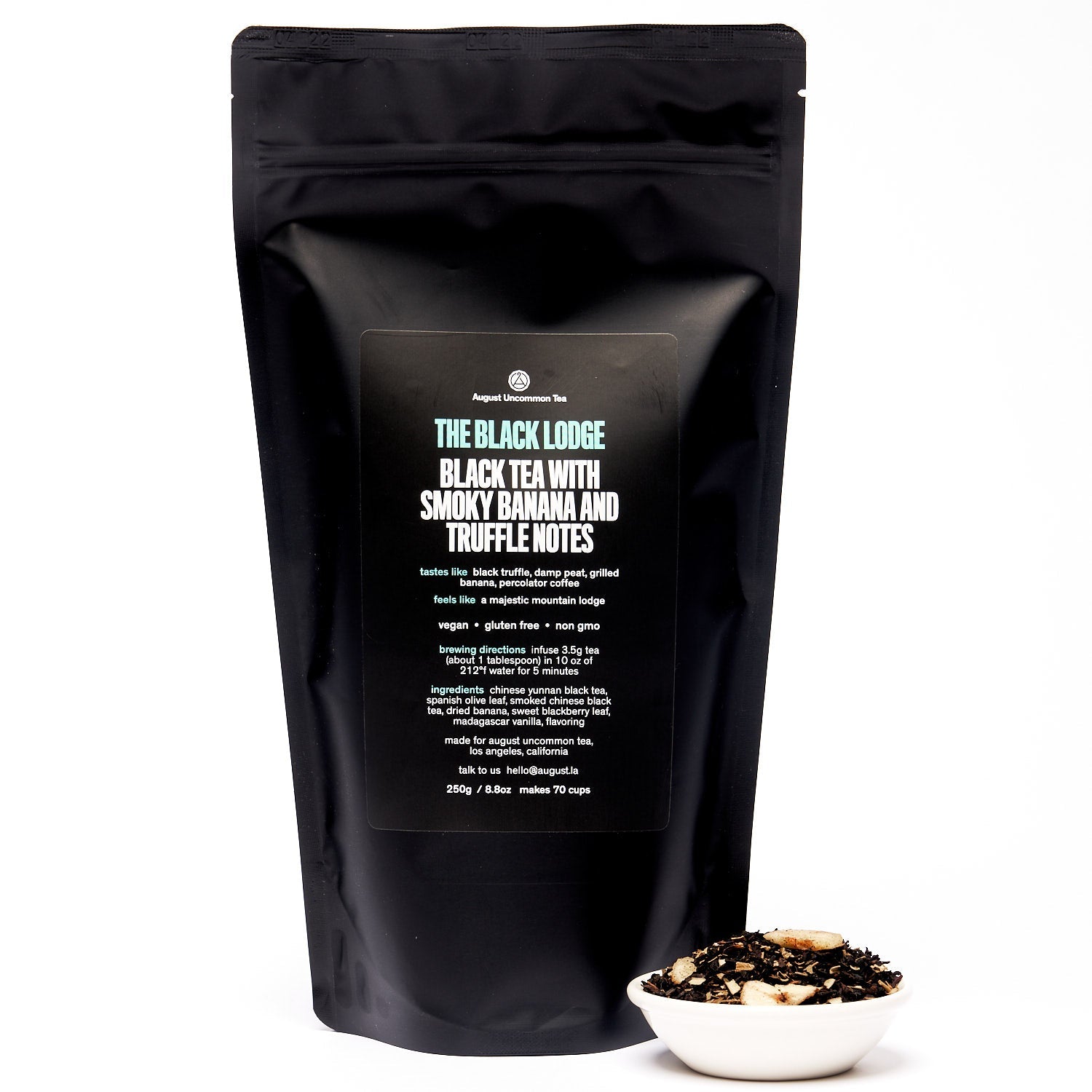 Black Lodge Smoky Banana Black Tea by August Uncommon Tea in a 15-cup bag, showcasing the tea leaves and packaging.