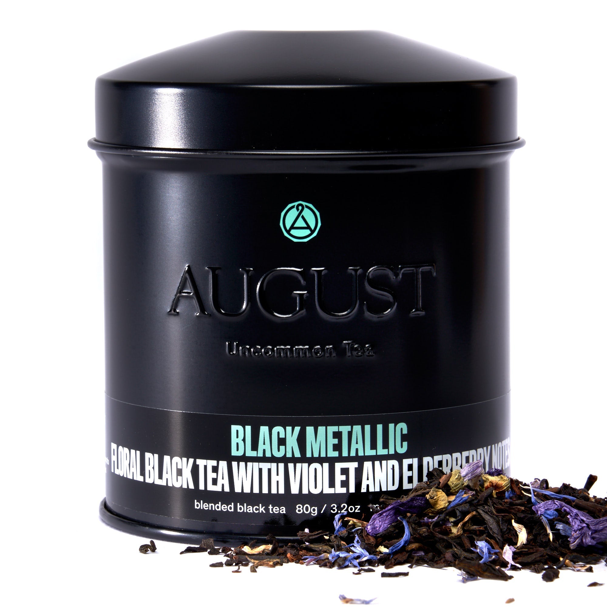 Black metallic tin of Violet Elderberry Black Tea by August Uncommon Tea, showcasing the elegant packaging and rich tea blend.