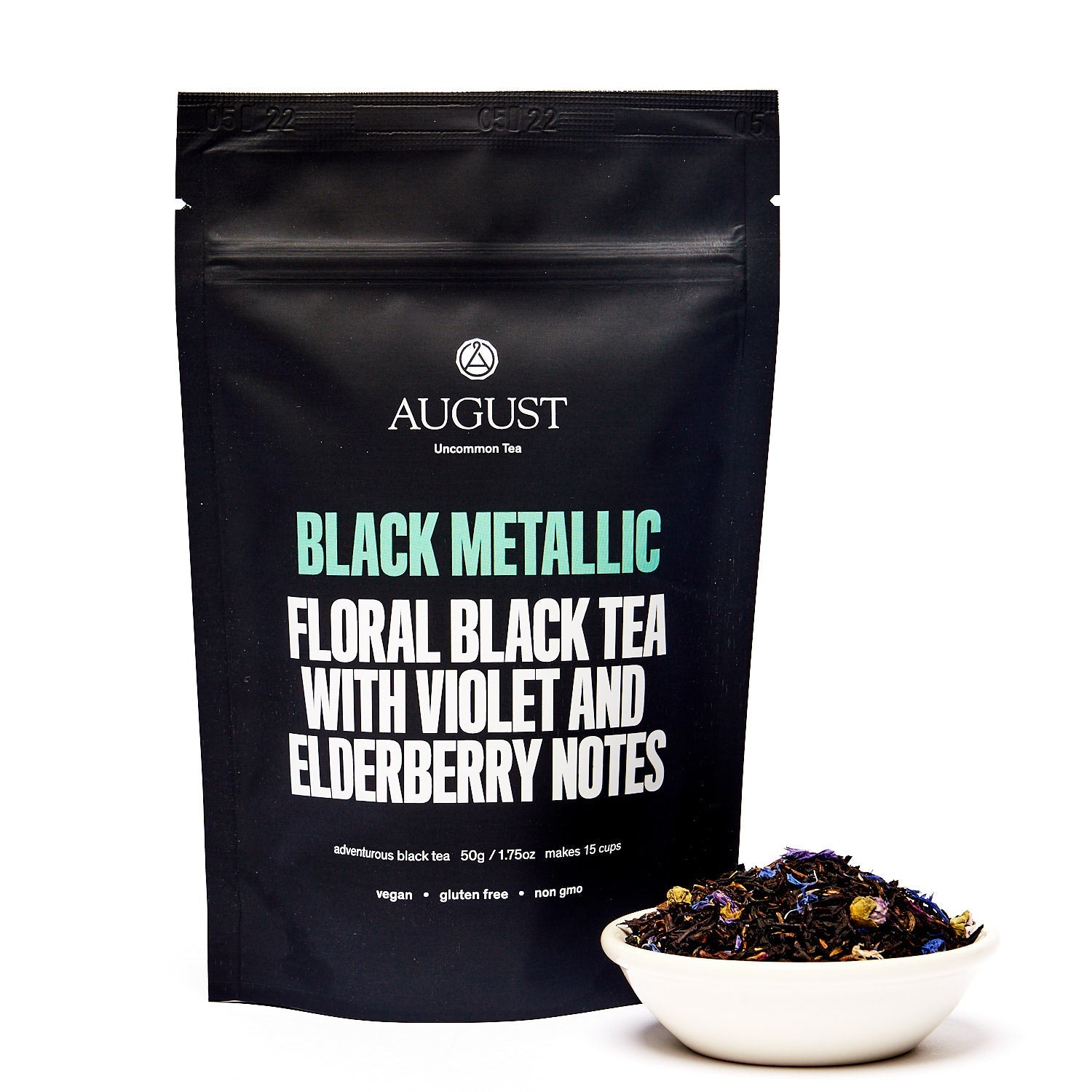 Black metallic tin of August Uncommon Violet Elderberry Black Tea, a premium black tea beverage in a sleek container.