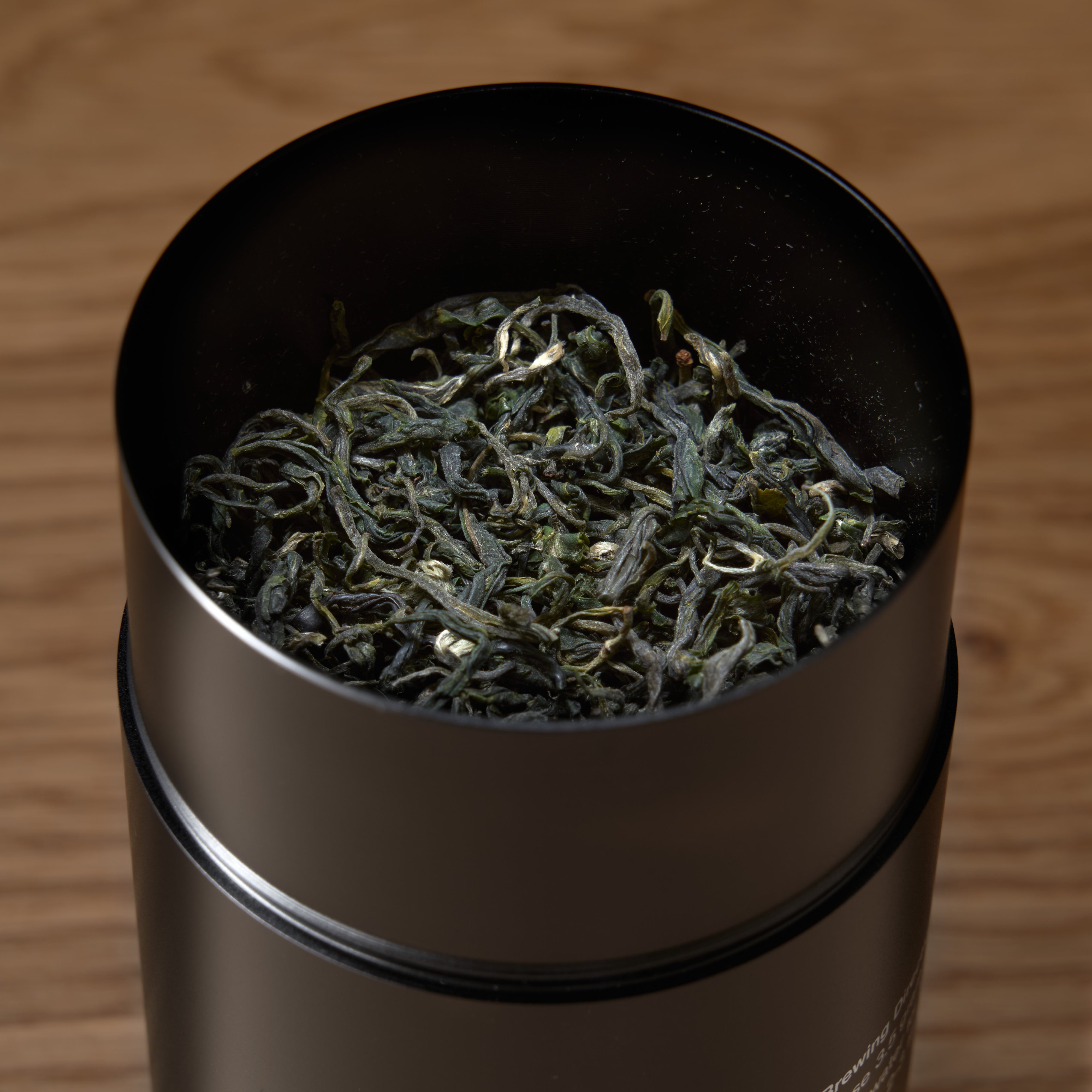 Single estate Pi Lo Chun green tea from August Uncommon Tea, featuring fresh, tightly rolled green tea leaves in a 60g tin.
