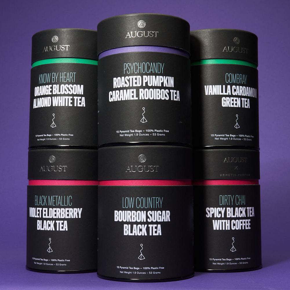 Assorted August Uncommon Tea bags from the All The Tea Bags sampler, showcasing a variety of tea flavors in colorful packaging.