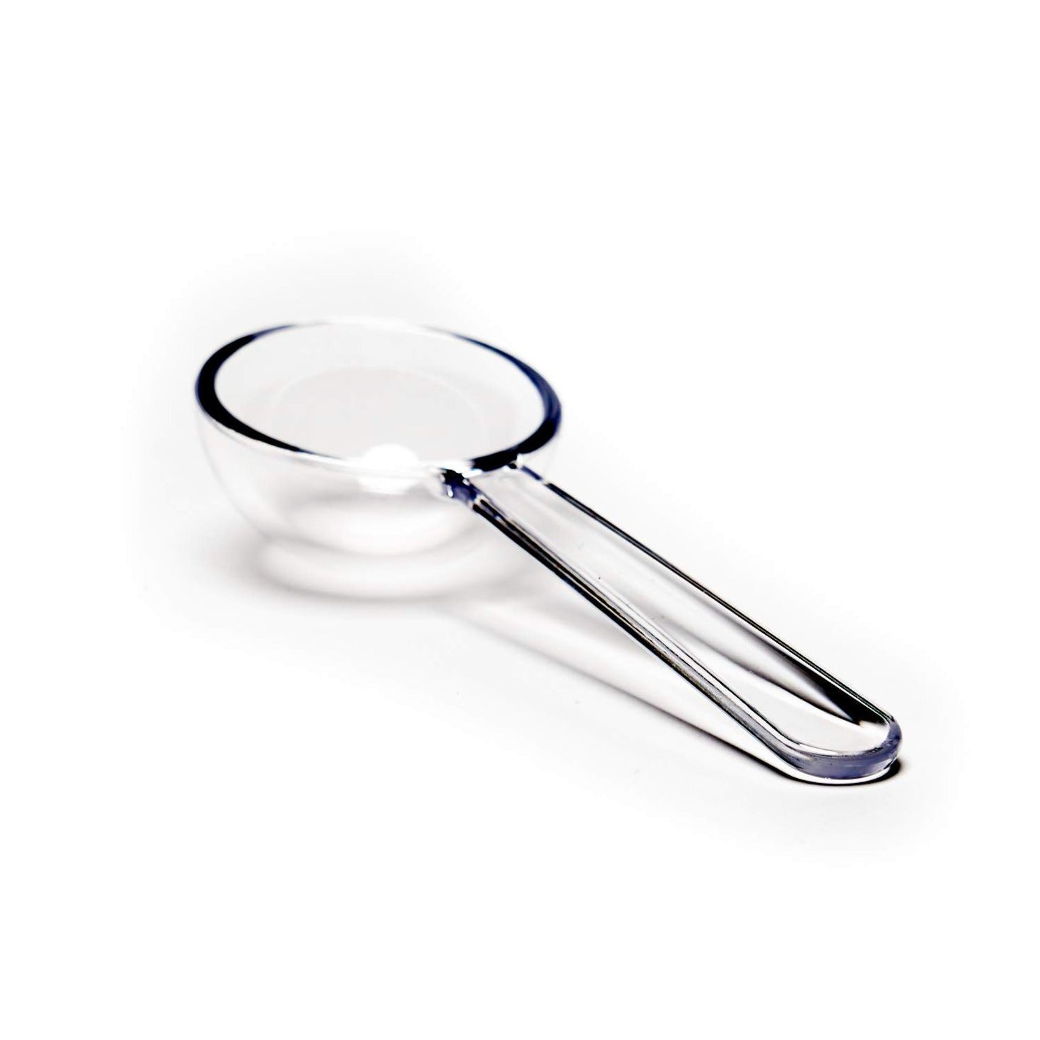 Crystal scoop for tea from August Uncommon Tea, designed for precise measuring of loose leaf tea in teaware.