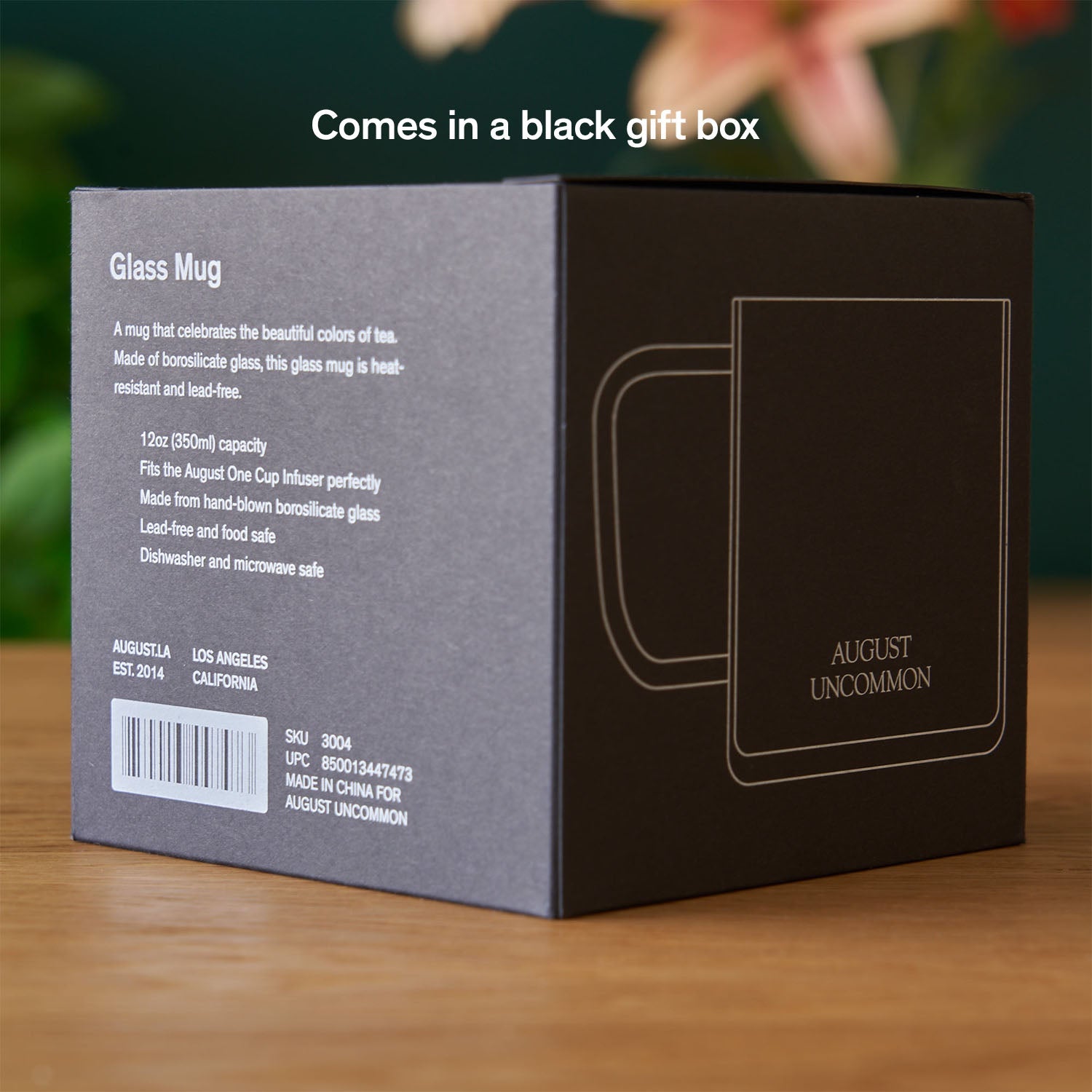 Clear glass mug from August Uncommon Tea, elegant teaware for hot beverages, showcasing a sleek and transparent design.