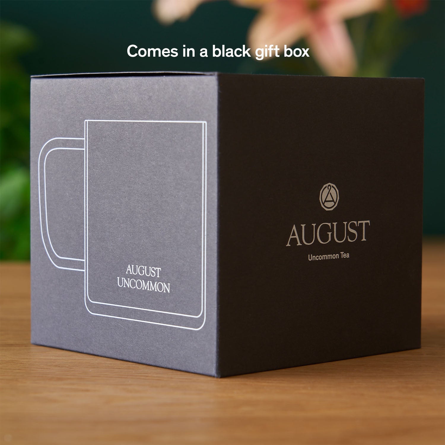 Clear glass mug from August Uncommon Tea, elegant teaware with a sleek design perfect for enjoying hot beverages.