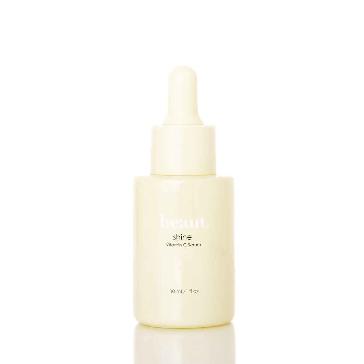 Two bottles of Beaut.BeautyCo. Shine Vitamin C Serum with orange-colored caps, placed side by side.