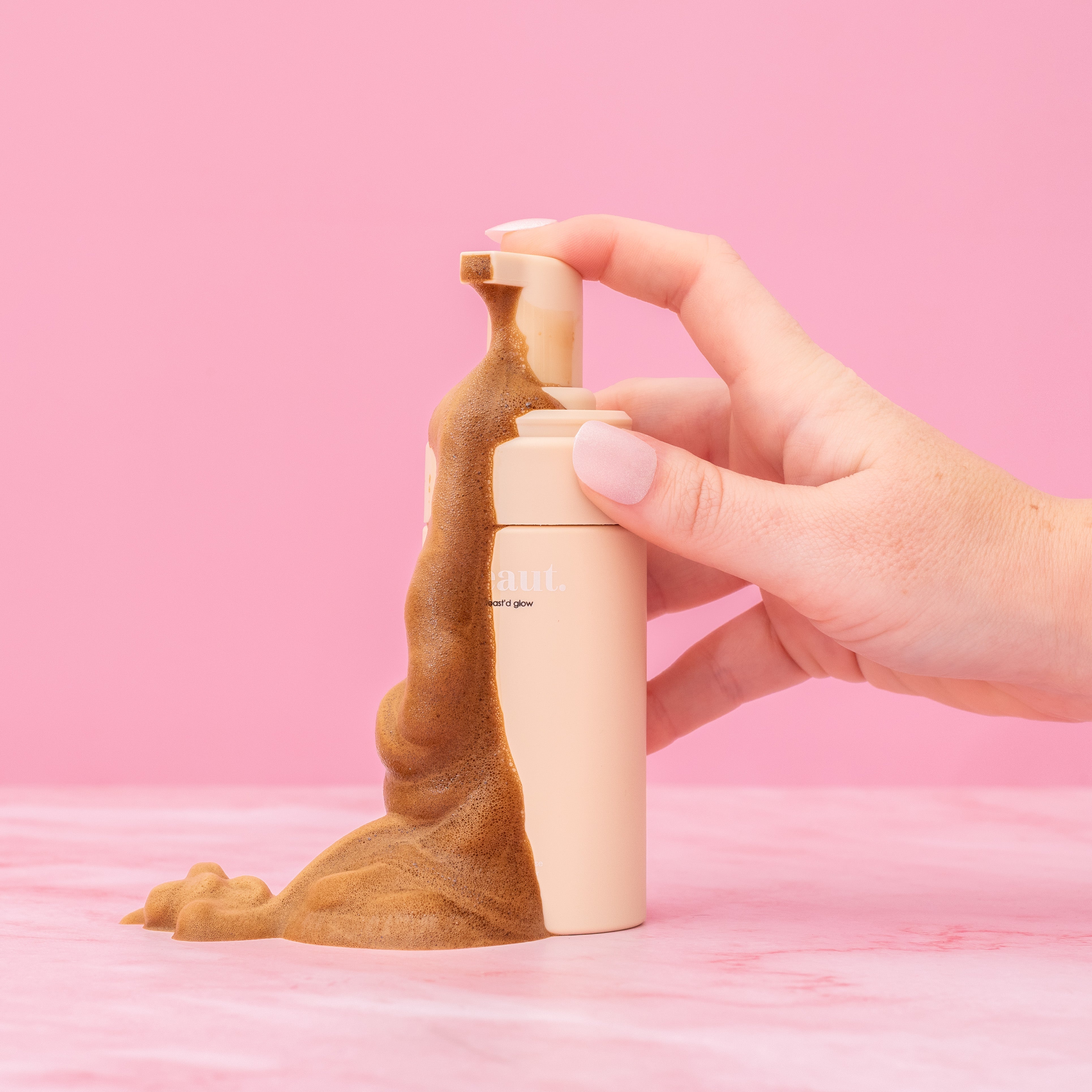 Beauty.co Toast'd Glow skincare product jar with gold accents and a sleek design, showcasing the luxurious packaging.