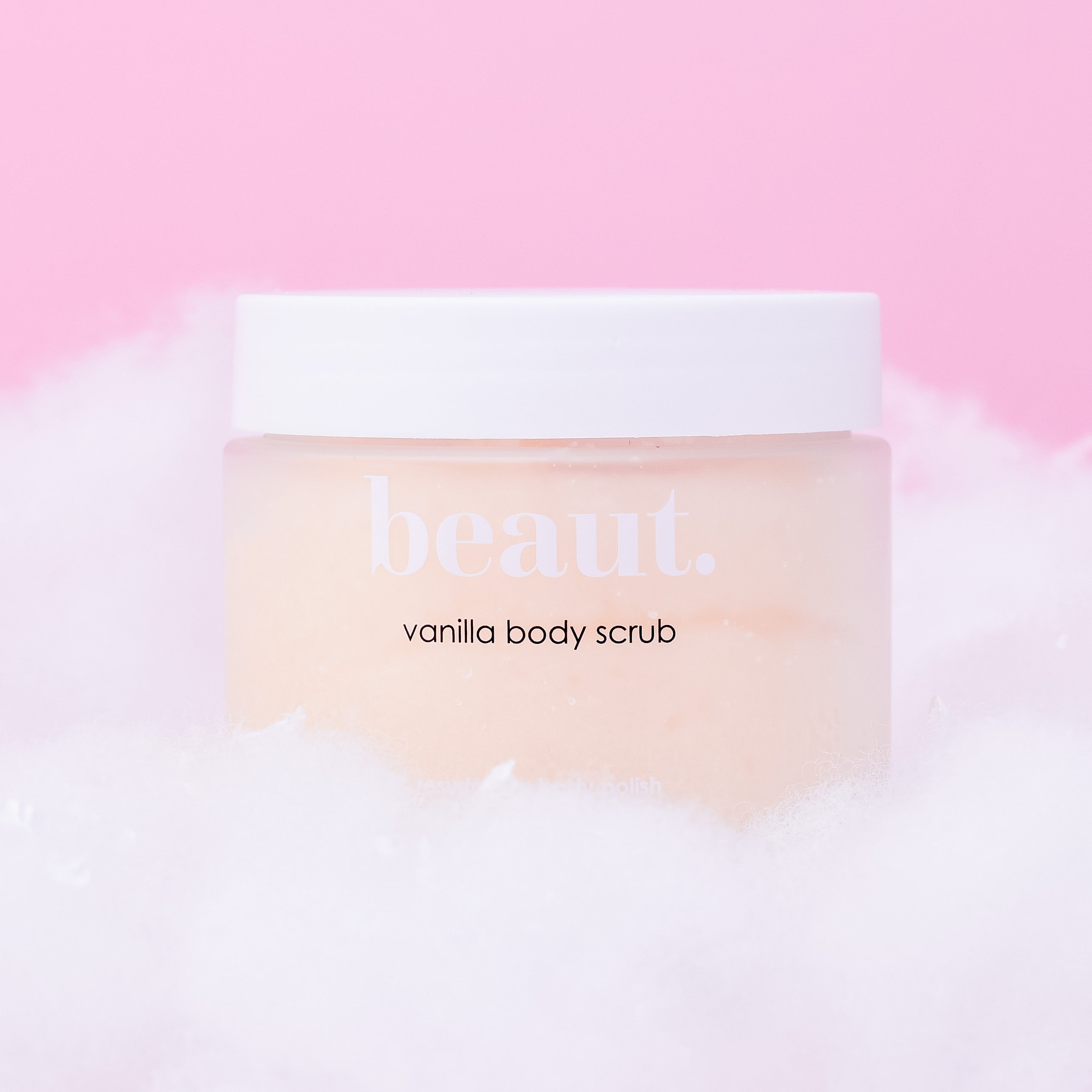 Lavender body scrub by beaut.beautyco featuring textured exfoliating particles and a lavender scent in a clear jar.