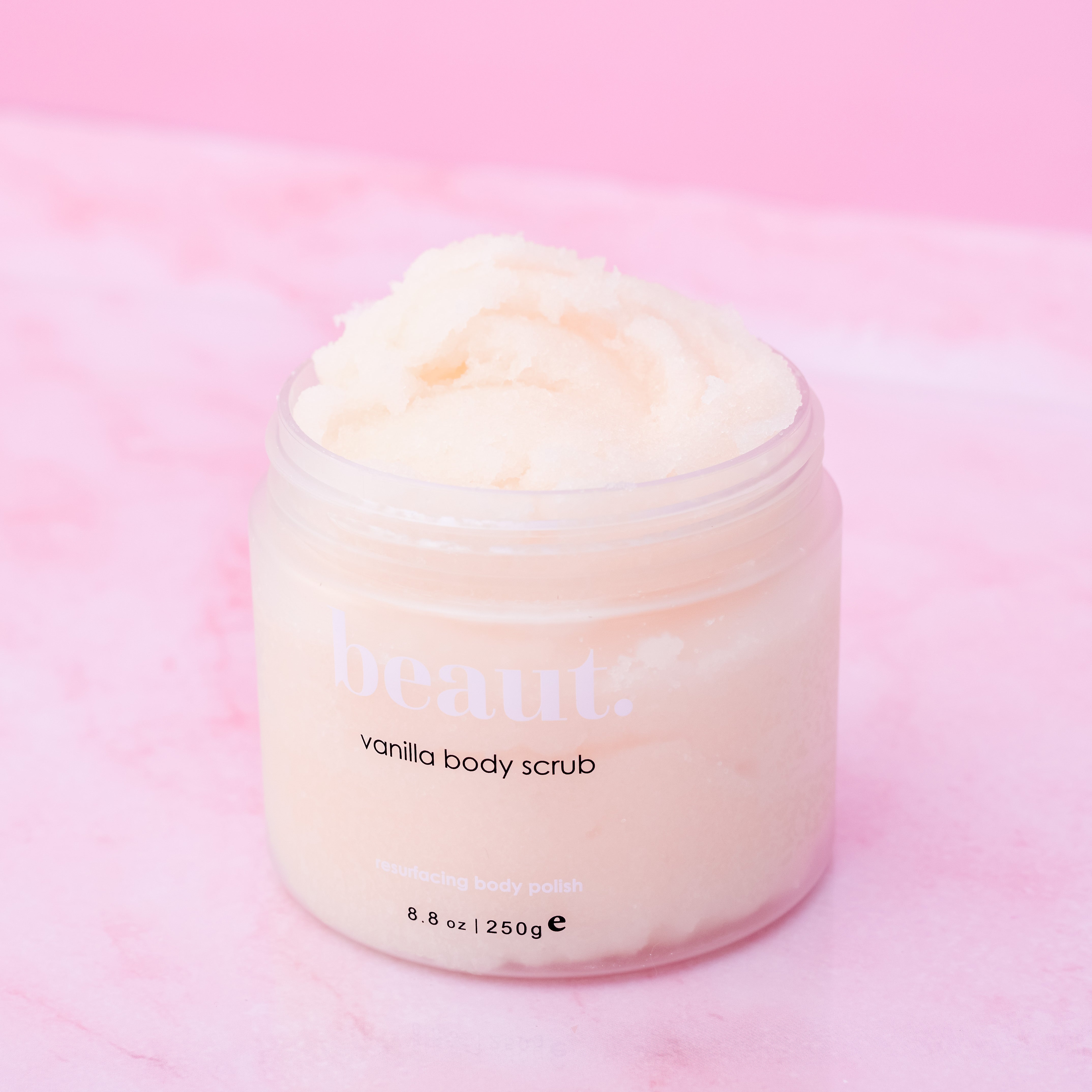Lavender body scrub by beaut.beautyco with a textured container, showcasing a natural exfoliating product for smooth skin.