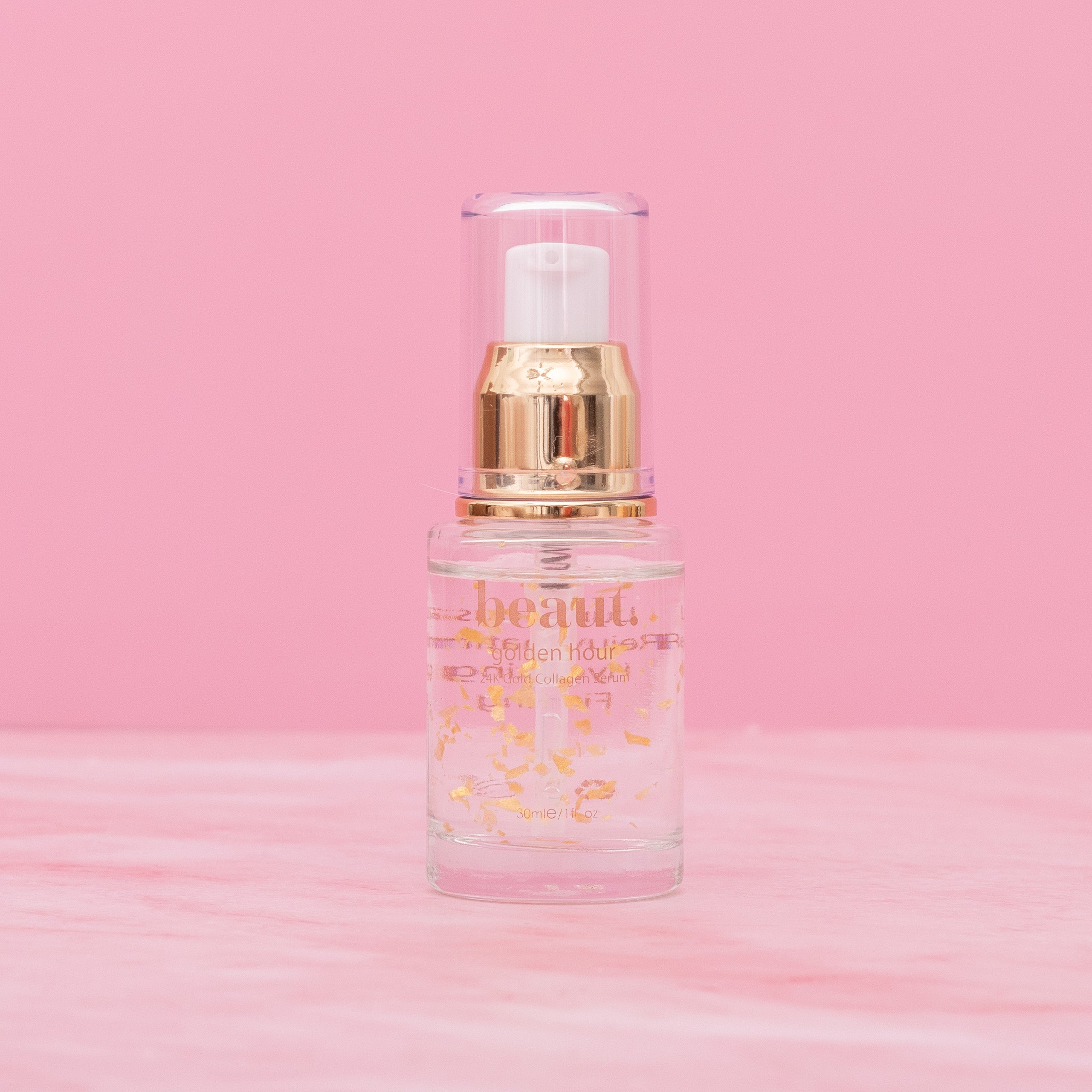 Bottle of Beaut.BeautyCo. Golden Hour 24K Gold Serum showing the sleek glass container with gold accents.