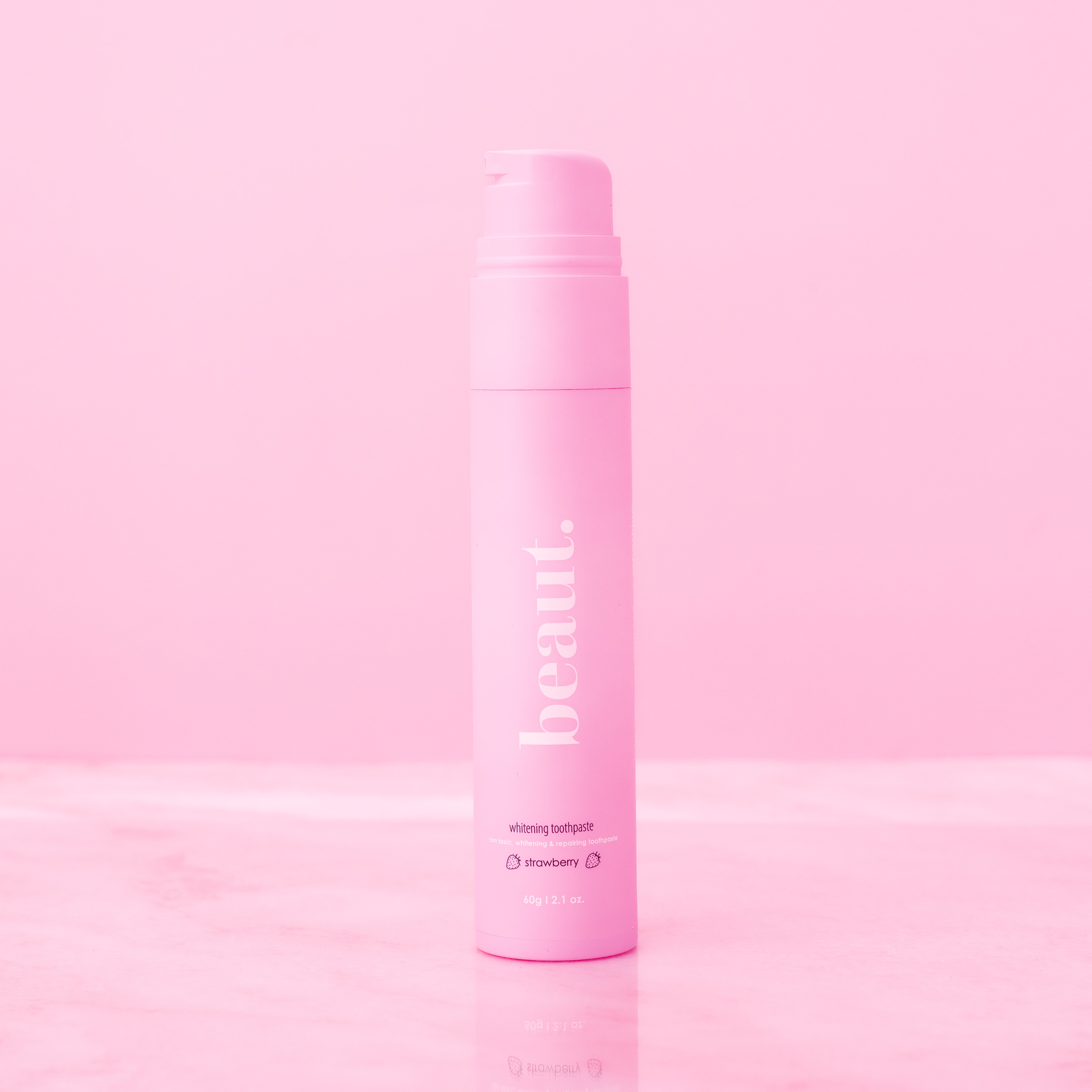 Beaut.beautyco strawberry whitening toothpaste tube with fresh strawberry design and brightening benefits.