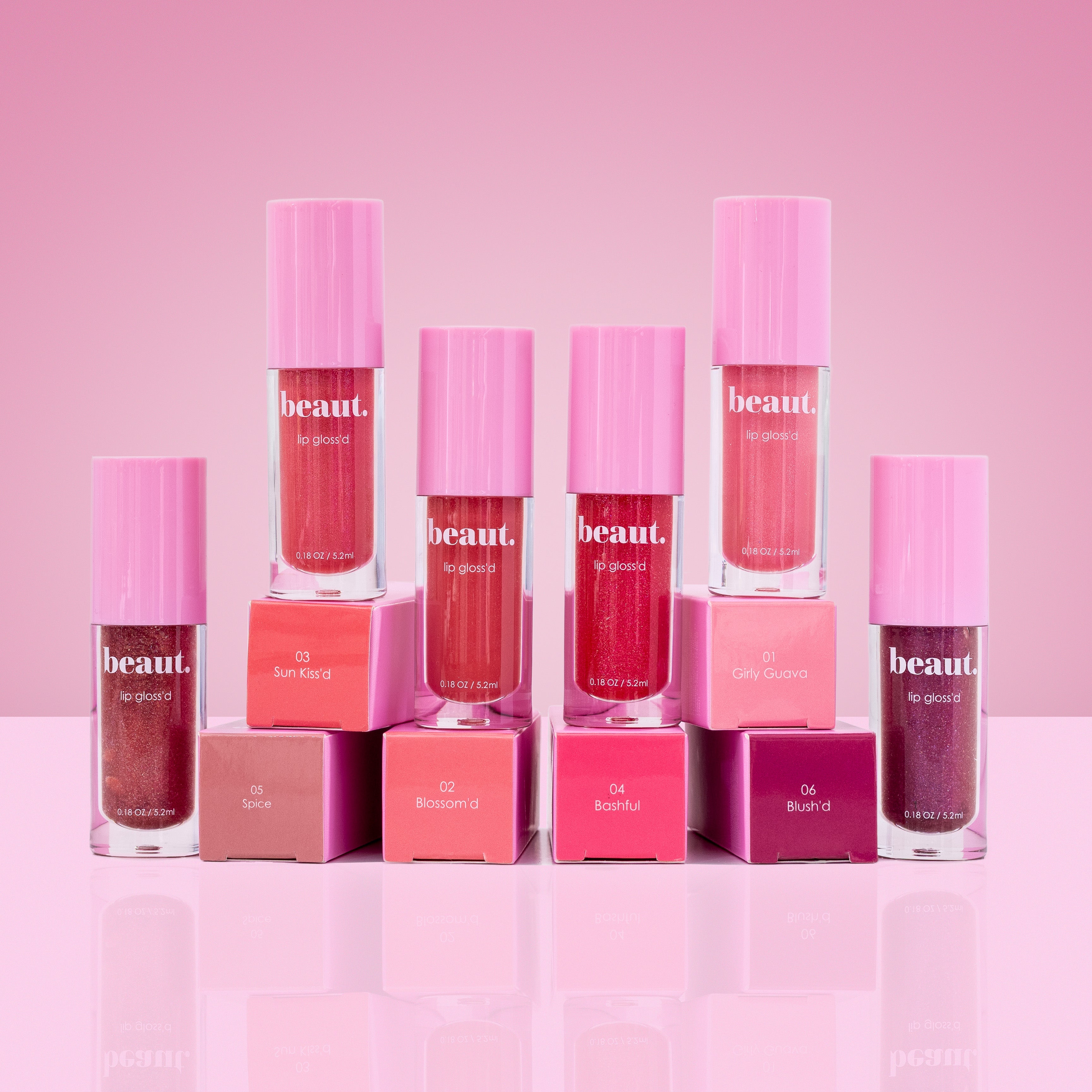 Sunkiss D lip gloss by beaut.beautyco. with a shiny, smooth application and a natural pink hue in a clear tube.