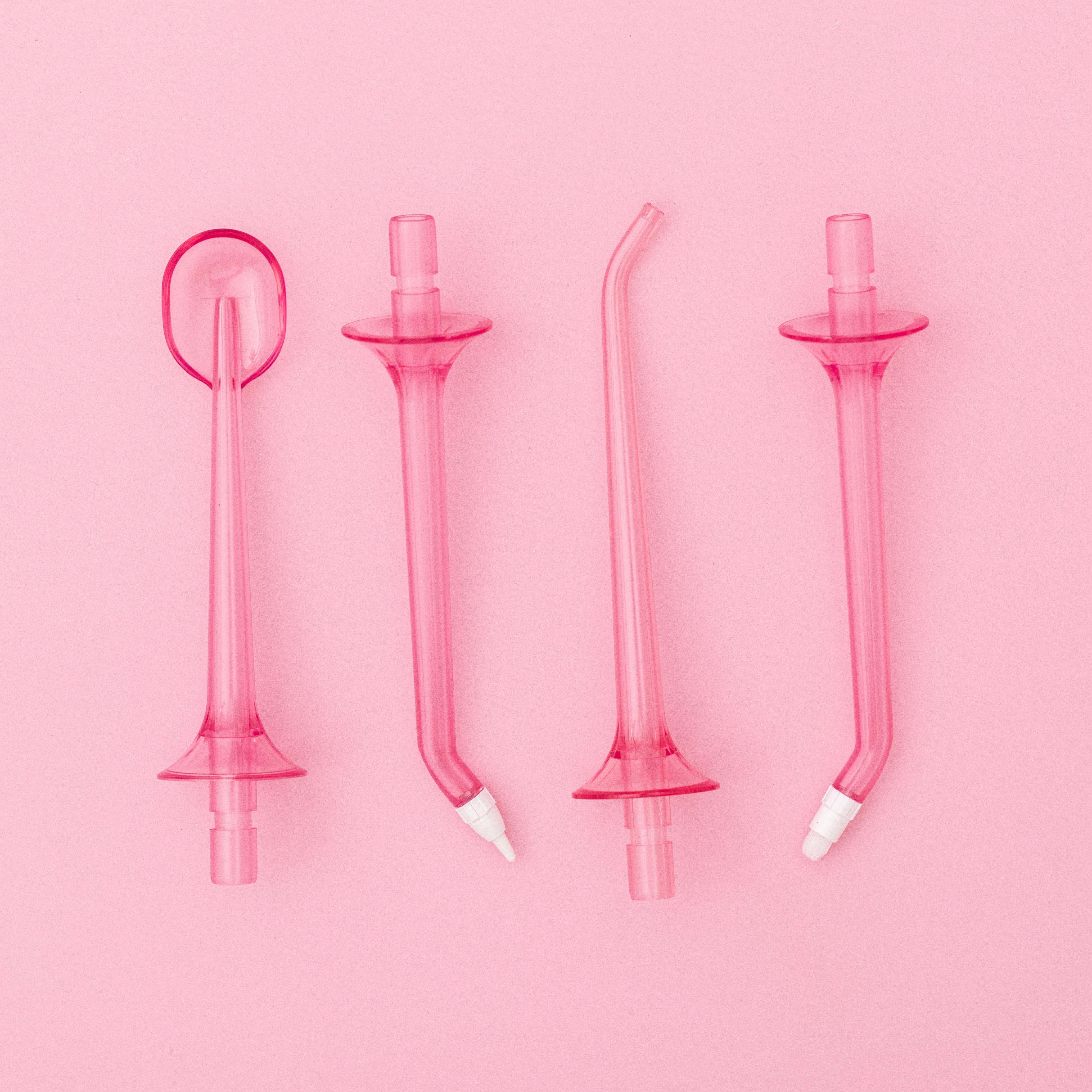 White H2O Hydroflossé by beaut.beautyco., a sleek water flossing device with a modern design and ergonomic grip.