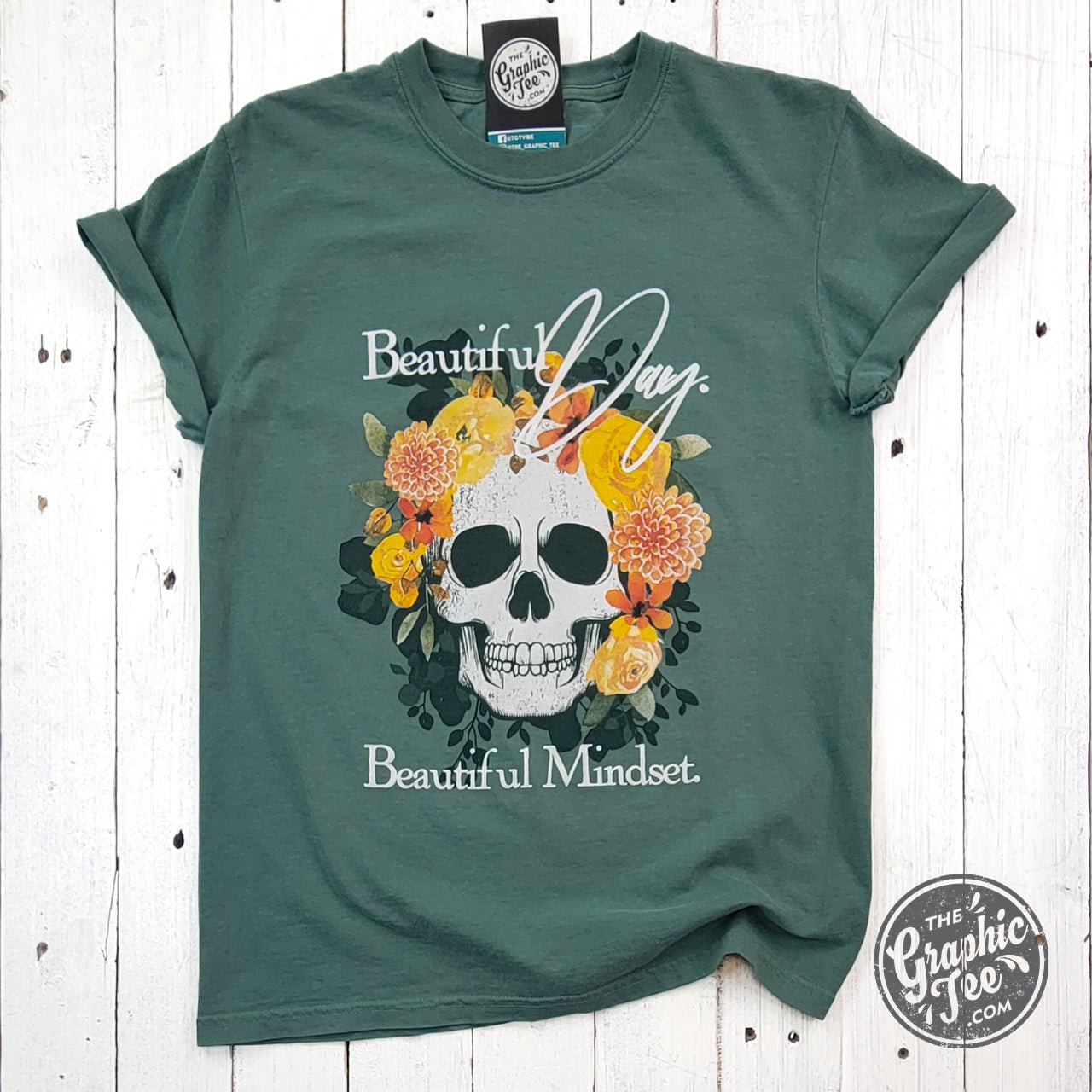 The Graphic Tee pigment dyed short sleeve graphic tee featuring the "Beautiful Day. Beautiful Mindset" design on soft fabric.