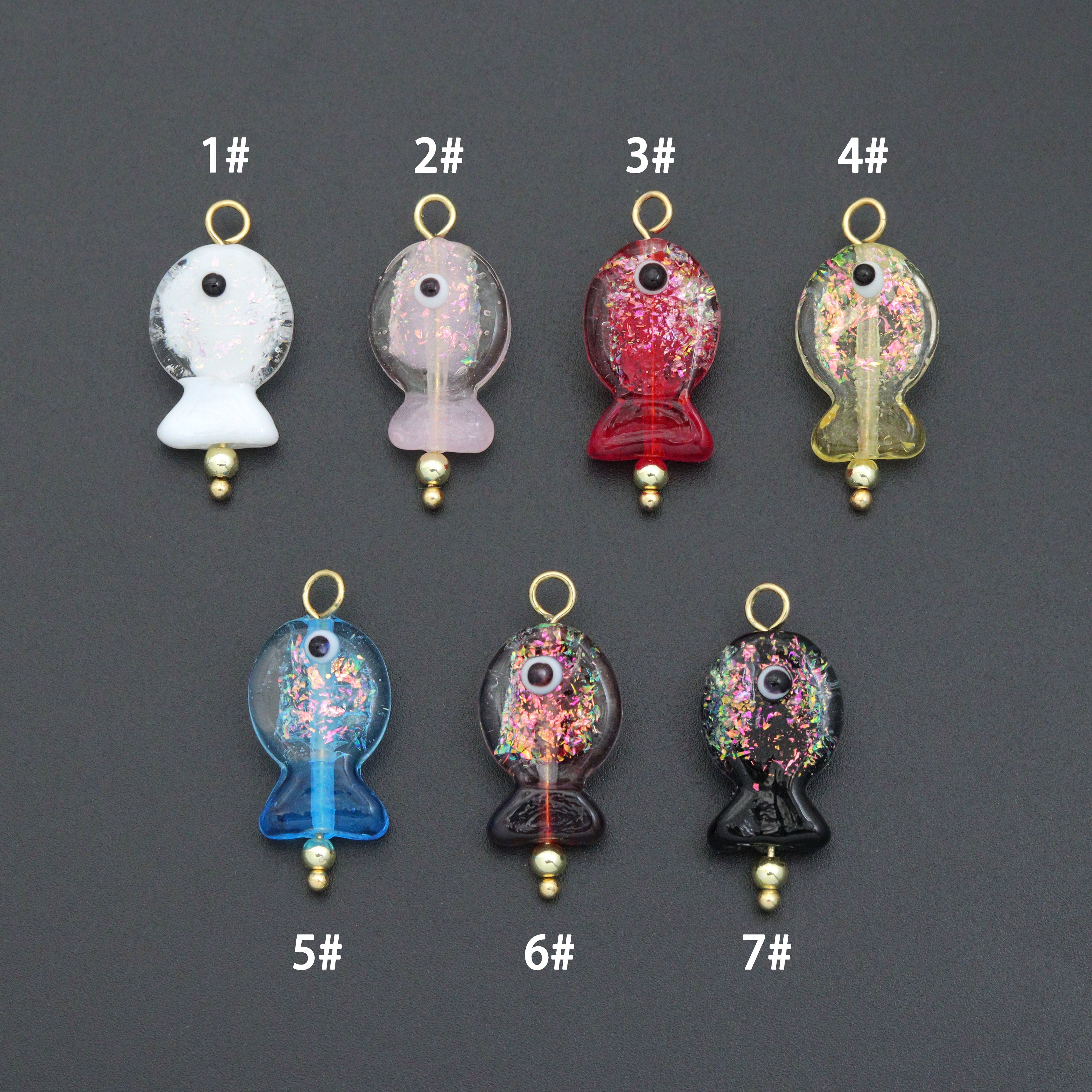 Handmade colorful glitter fish charm with evil eye design, crafted by Bestbeads&Beyond, featuring vibrant details and a lucky symbol.