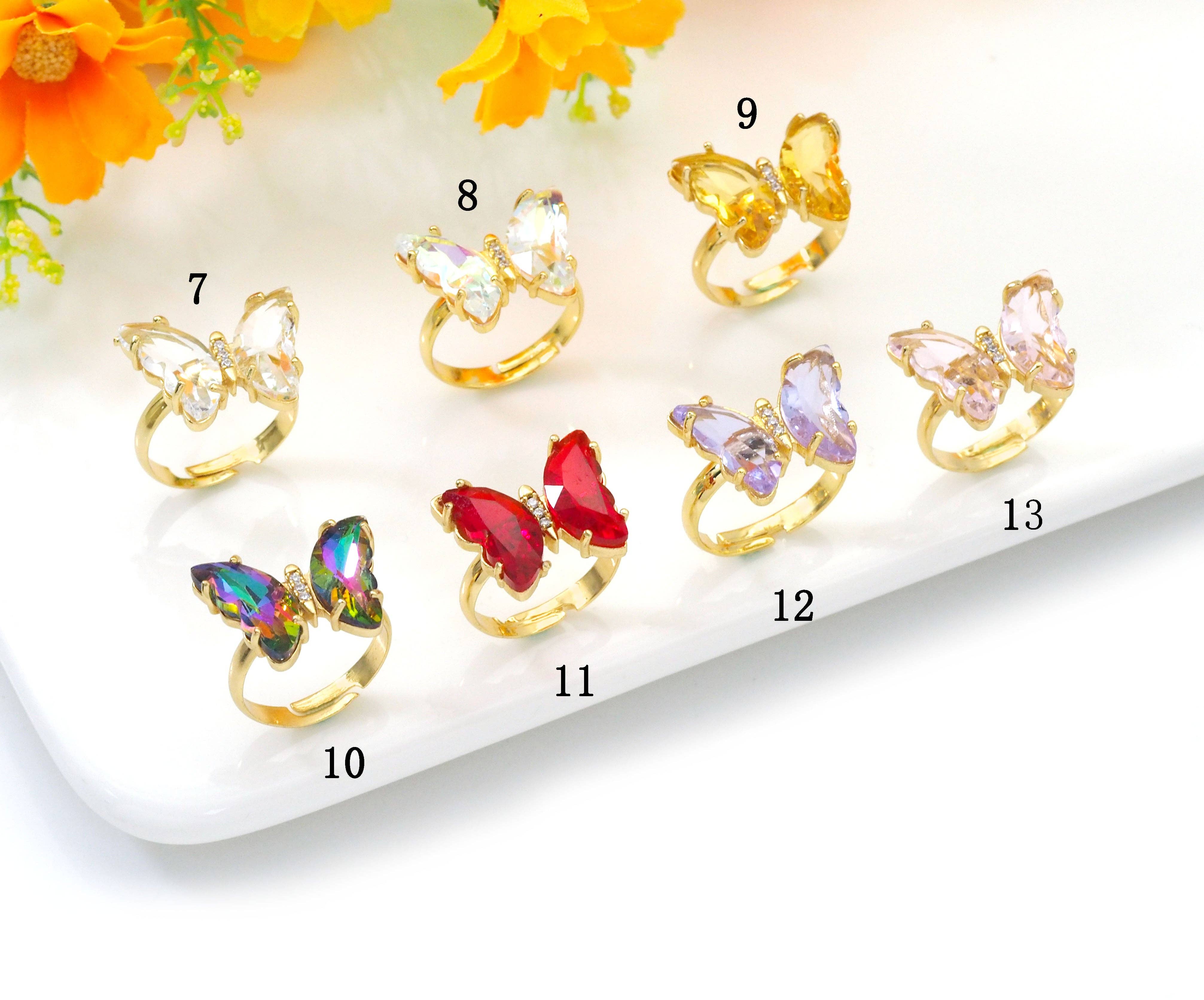 Colorful crystal butterfly adjustable cocktail ring by Bestbeads&Beyond featuring vibrant blue crystals and intricate butterfly design.