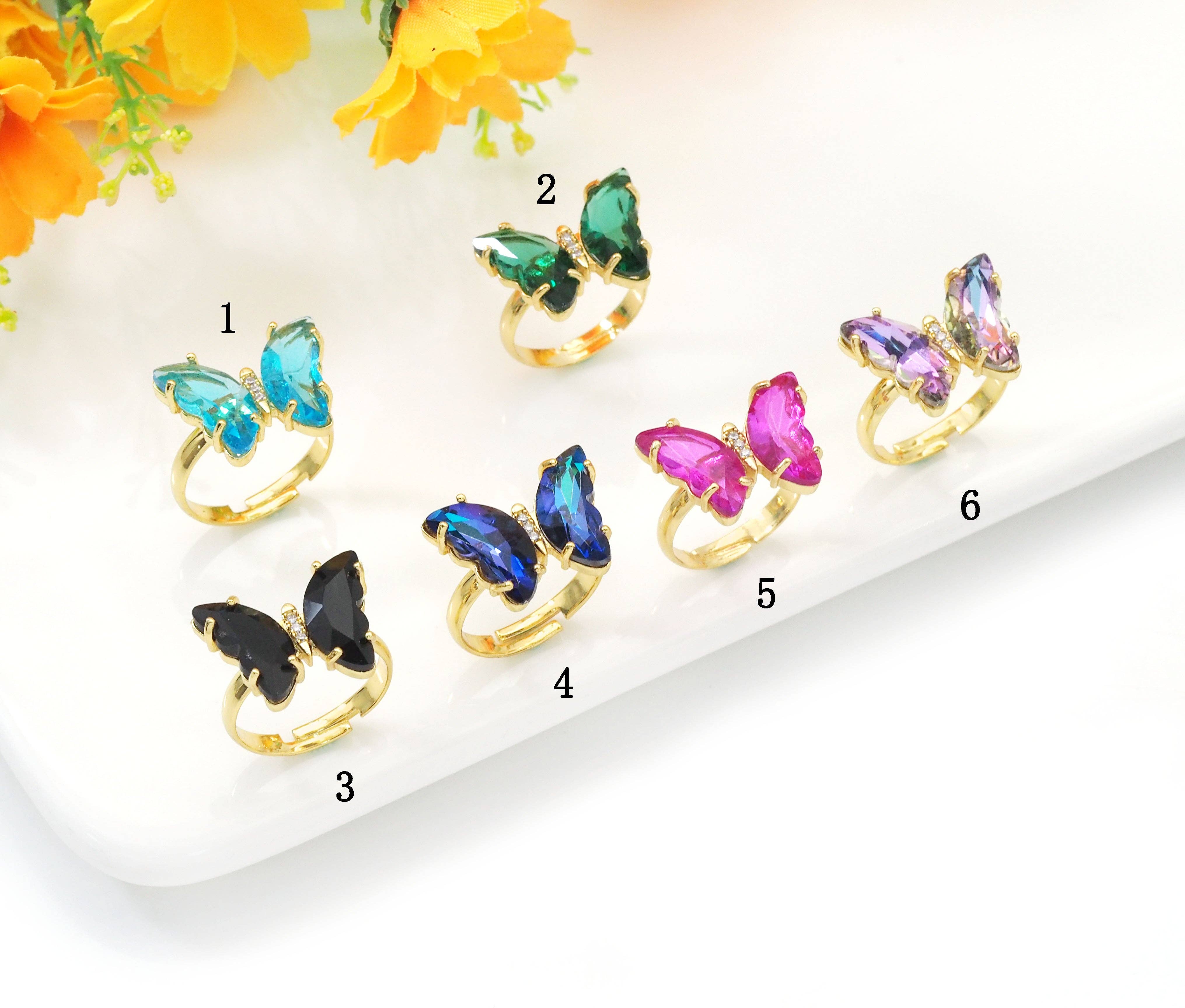 Colorful crystal butterfly adjustable cocktail ring by Bestbeads&Beyond featuring vibrant blue and multicolor crystals.