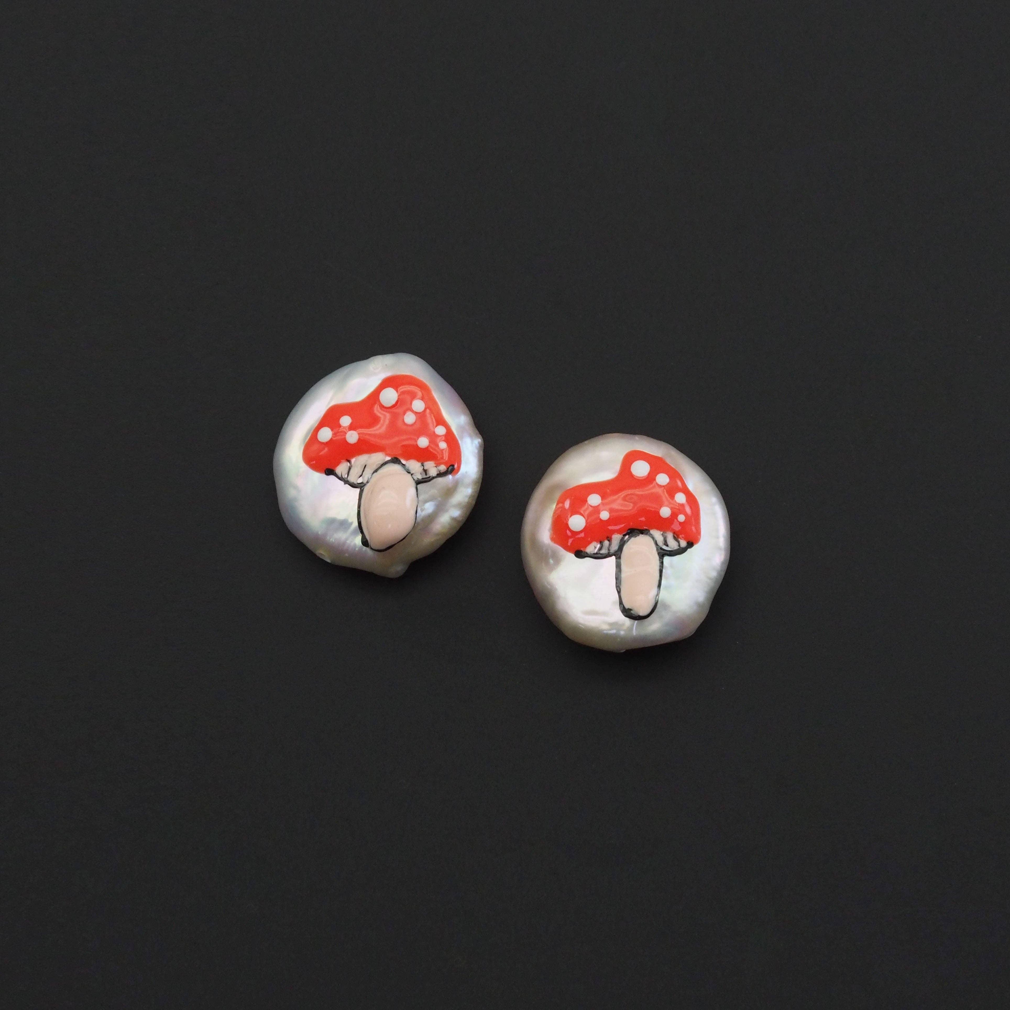 Red mushroom pendant on white pearl spacer beads, handcrafted charm from Bestbeads&Beyond, perfect for jewelry making.
