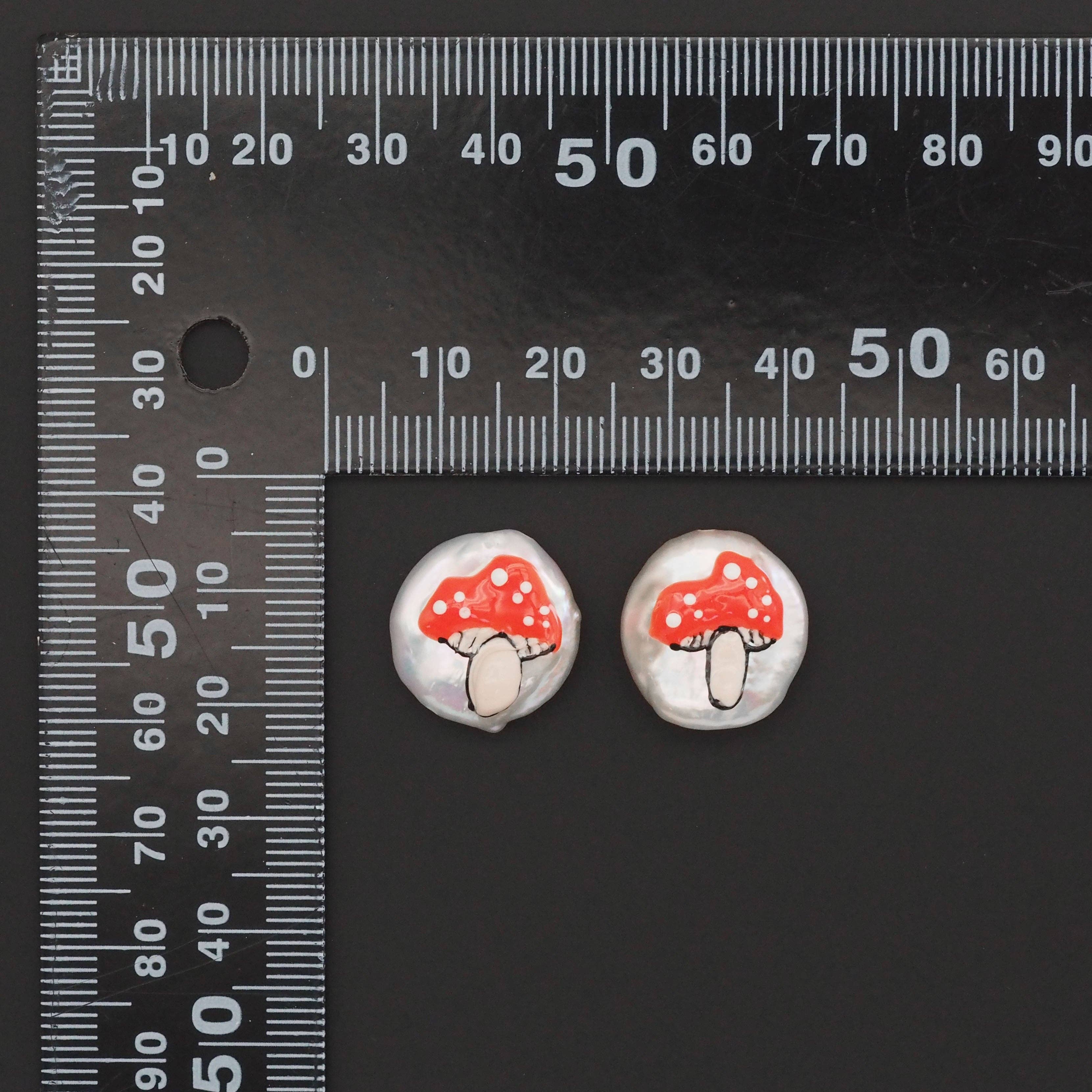 Red mushroom pendant with white pearl spacer beads, individual charm from Bestbeads&Beyond, jewelry accessory with detailed design.