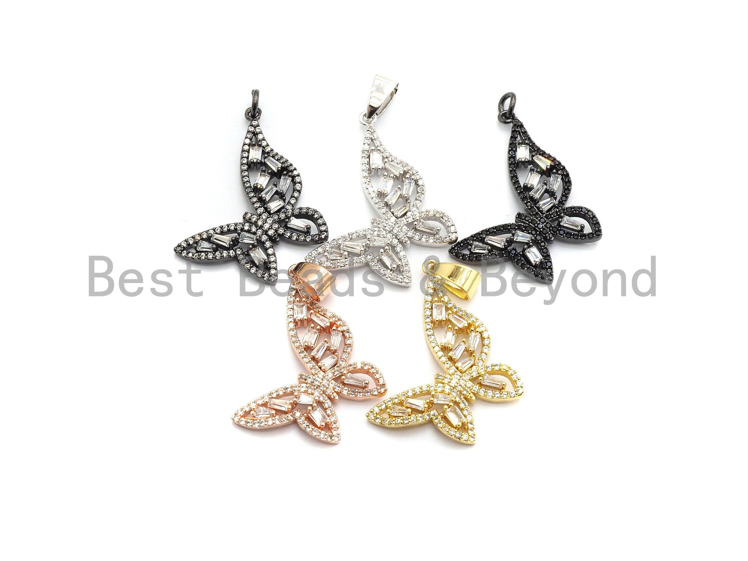 Gold, silver, black, or rose gold plated butterfly pendant with micro pave CZ and baguette CZ cluster, 29x31mm charm.